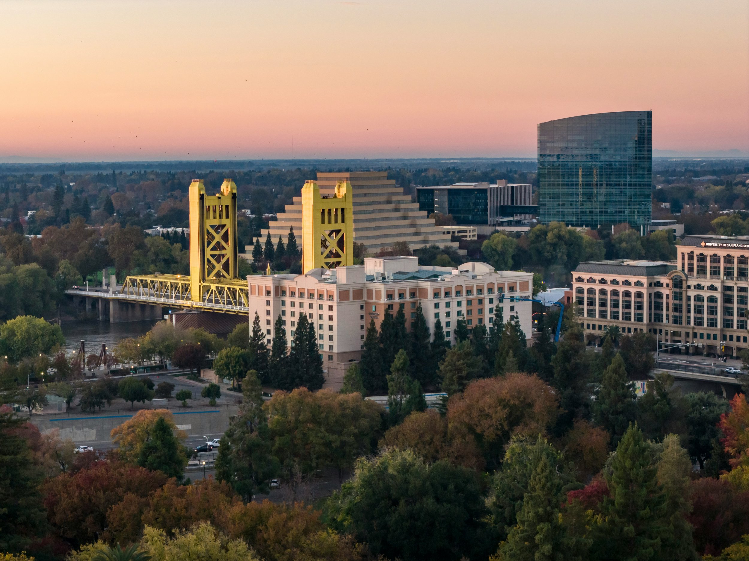 Sacramento skyline at dusk bridge and office buildings