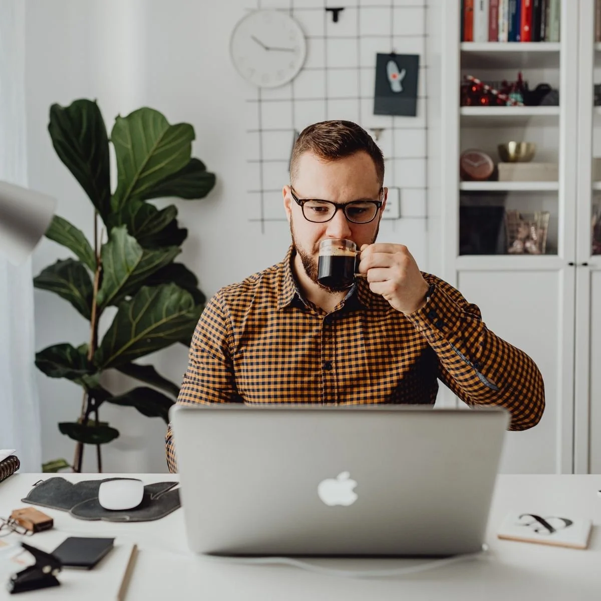 Attorney led property management company Sacramento CA  man drinking coffee at laptop