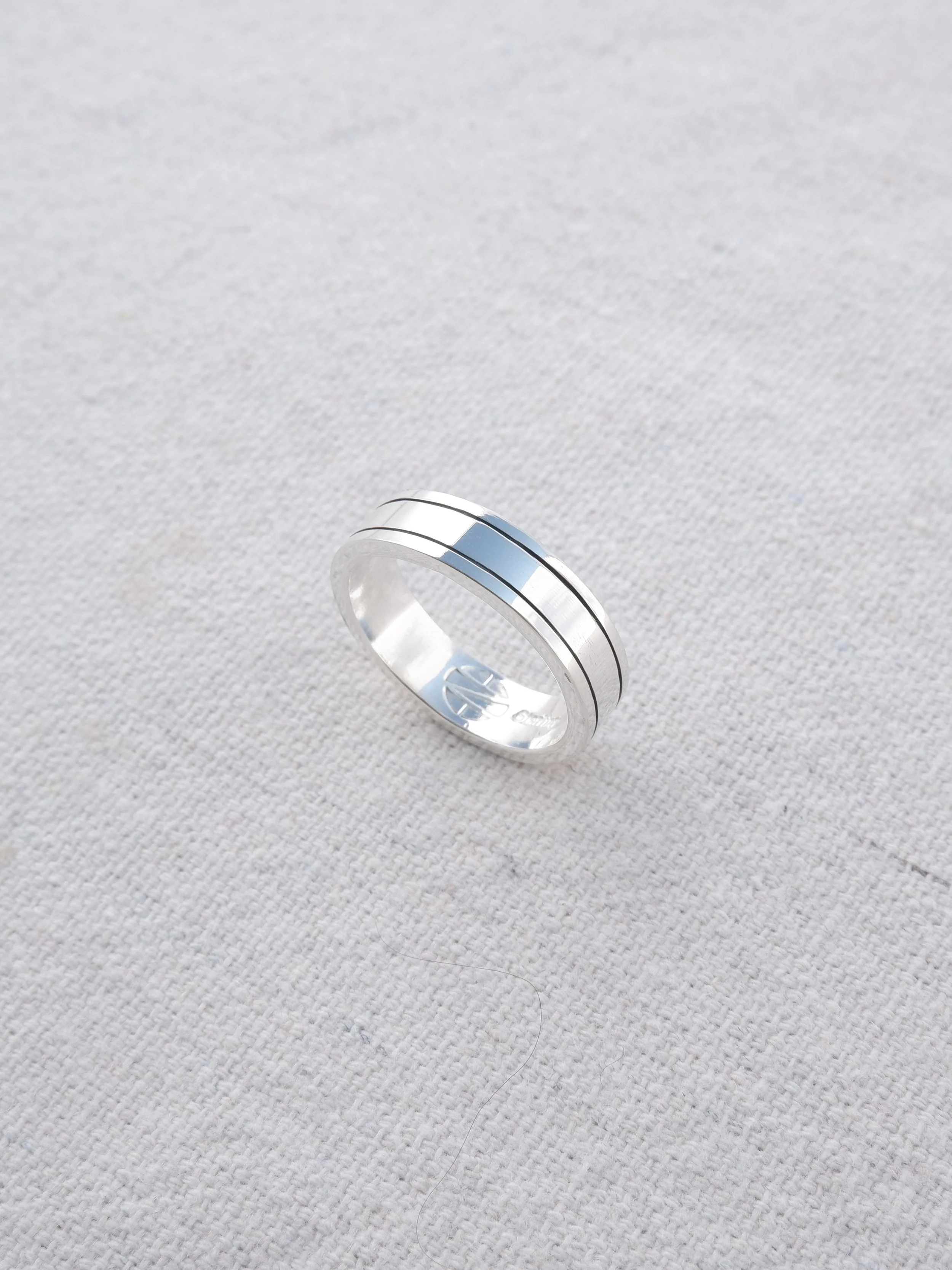 ENB silversmith instructor polishing class wide band ring.jpg