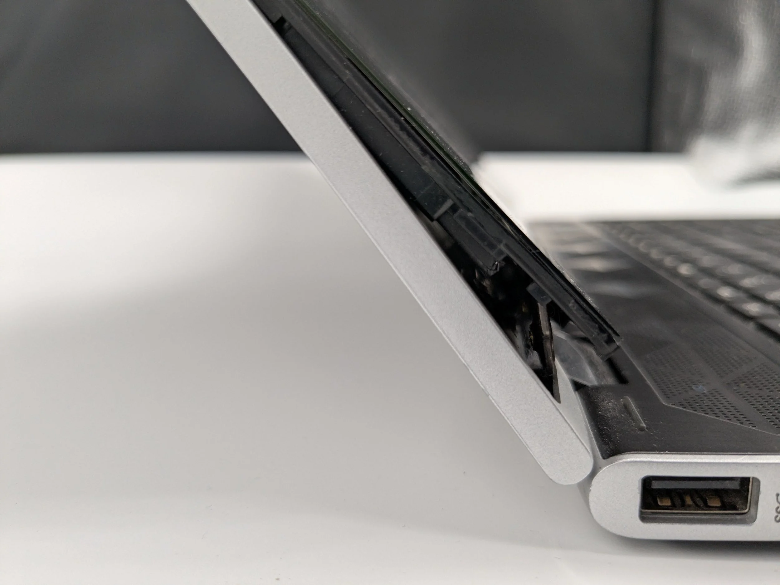Laptop Hinge Broken and Screen Pushed Out of the Lid? Here's What's Wrong and How It's Fixed