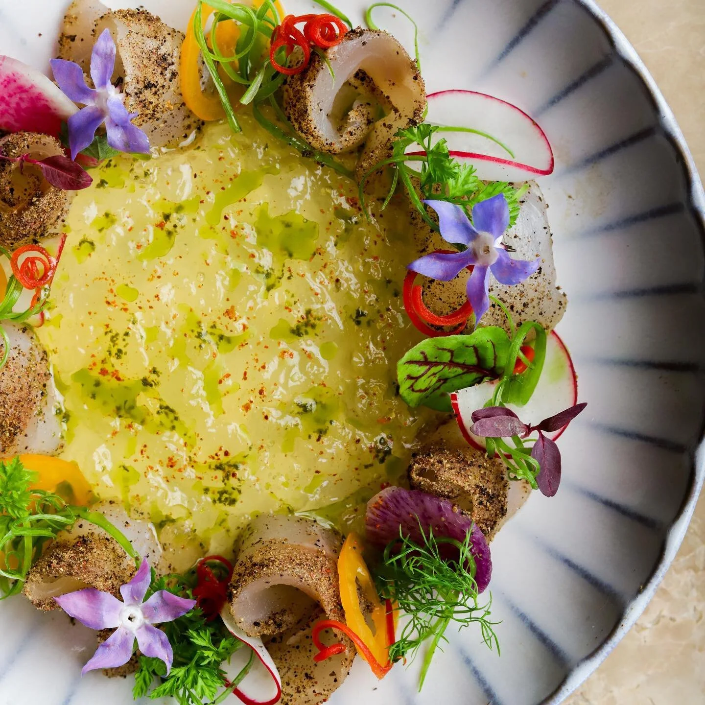 Inspired by the flavors and colors of the Mediterranean, our Seared Bronzino Crudo uses the freshest ingredients, served with pierre-poivre spice, MediterrAegean gazpacho, fennel and koroneiki olive oil. Clean, whole and delicious. #AVAMediterrAegean