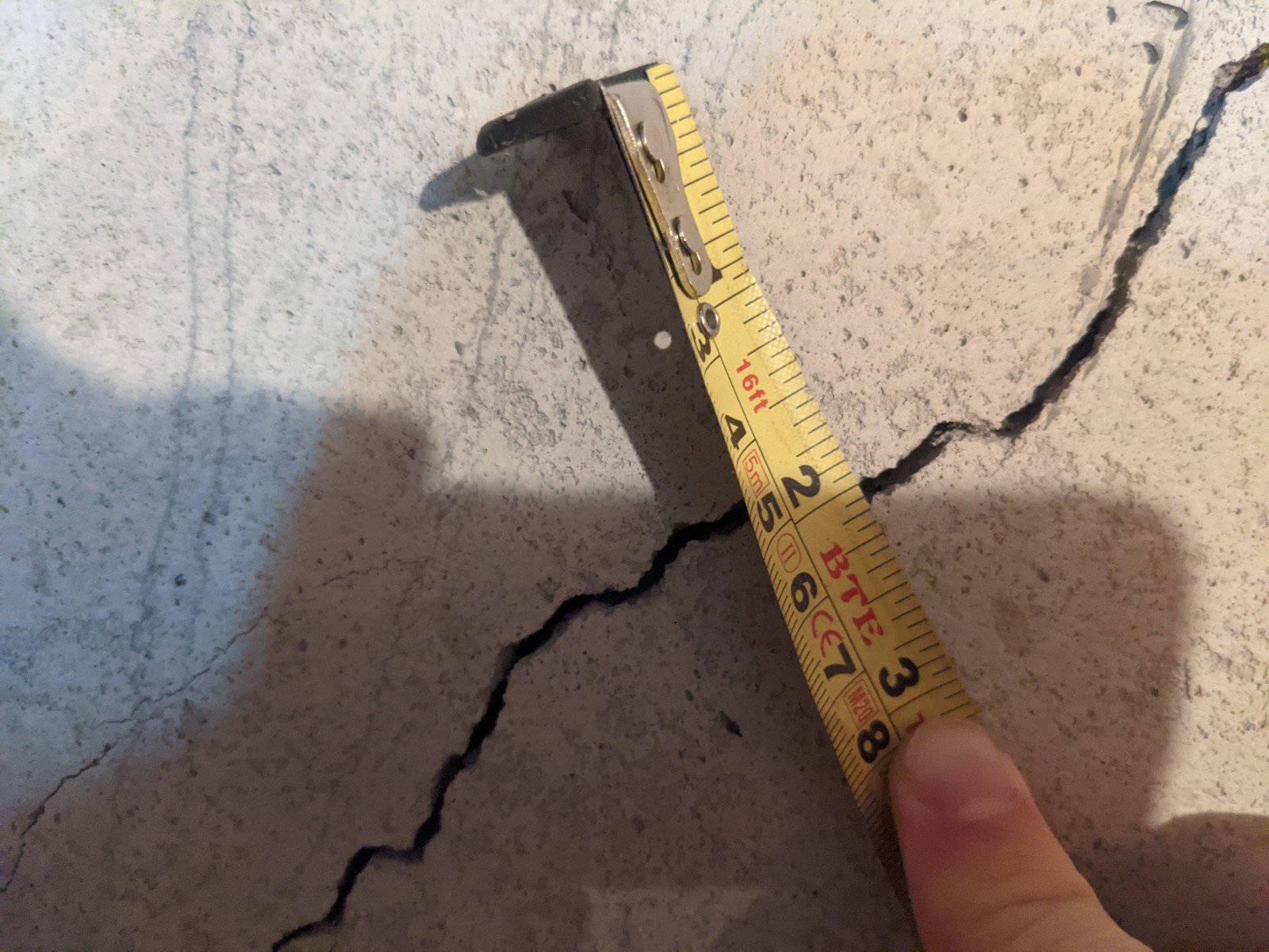 This diagonal crack is ~1/8" wide.