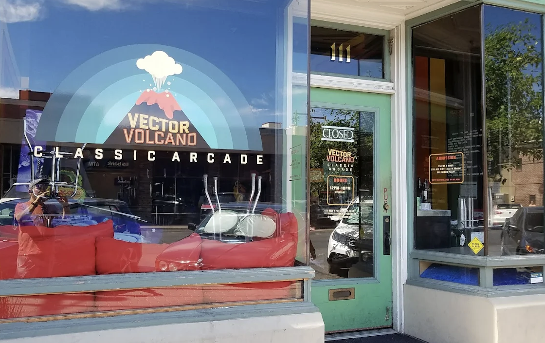 Streetside photo of the logo of Vector Volcano in downtown Bend, Oregon.