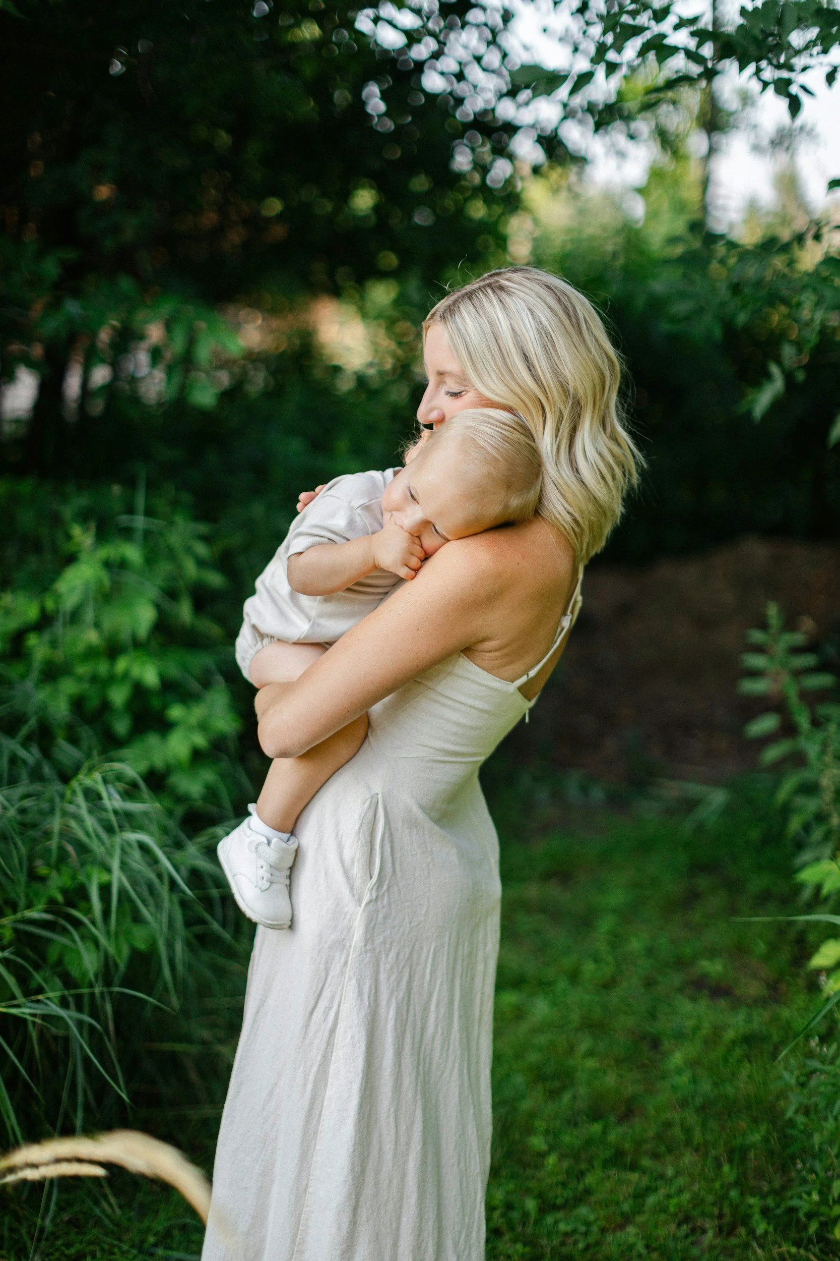 a mother holds her son in a cincinnati park