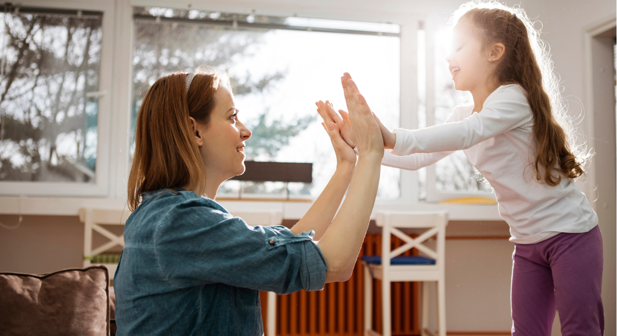 nanny and child playing in the kitchen of a cincinnati home. employers that partner with elite nannies on demand give their employees access to high quality backup childcare to reduce absenteeism. cincinnati nanny agency, nanny agency cincinnati
