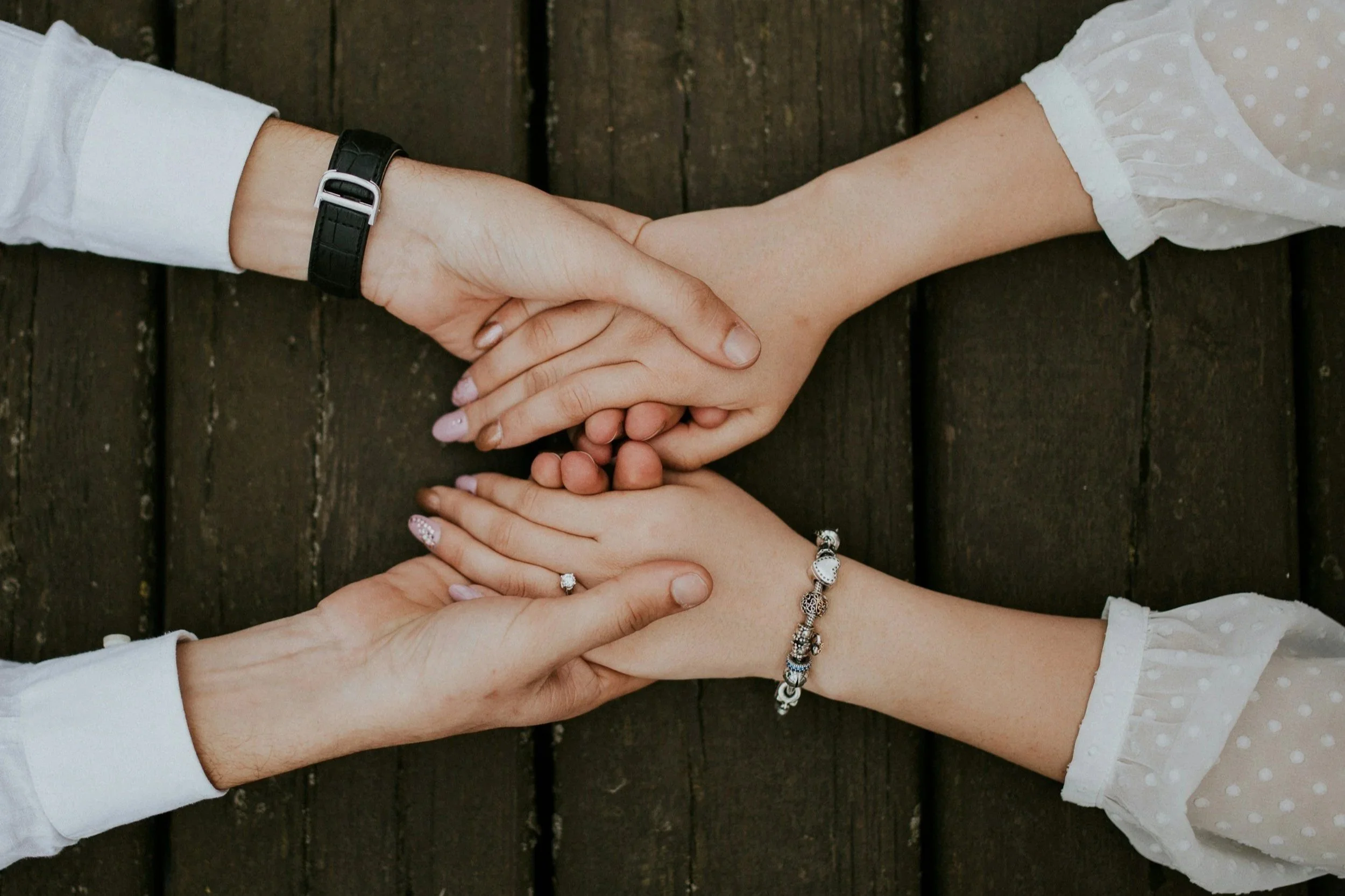 two people holding hands.