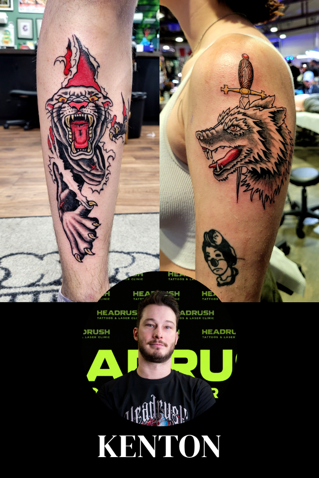 A young man with short brown hair and a beard stands with arms crossed, wearing a black t-shirt with colorful artwork and tattoos on his arms, in front of a backdrop with neon green and black lettering.