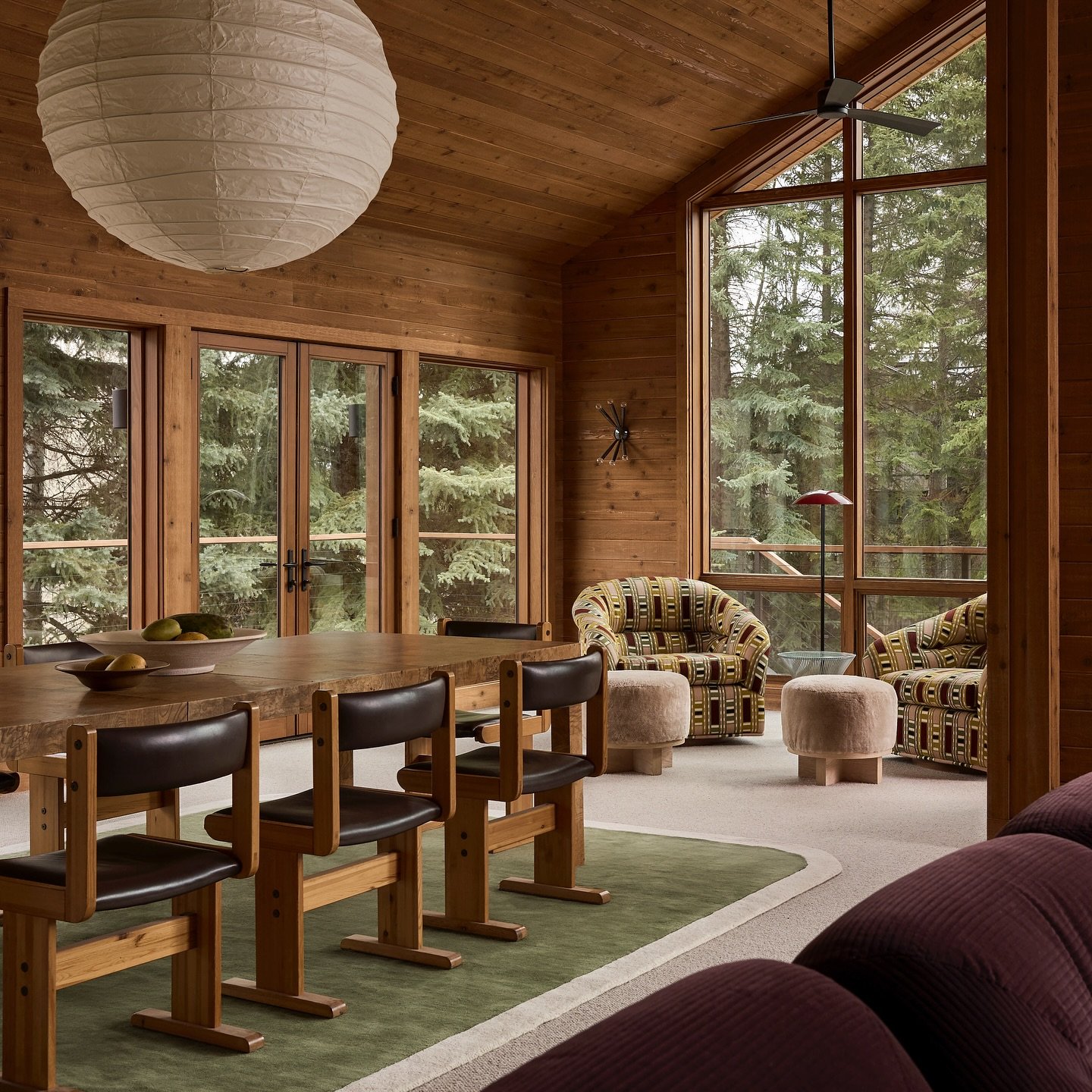 Our #yisunvalleyskihouse is surrounded by the most beautiful trees - the main level is perched high so the treehouse experience is real. Surrounded by trees outside and grounded by a pair of swivel chairs draped in the loveliest @lamaisonpierrefrey f
