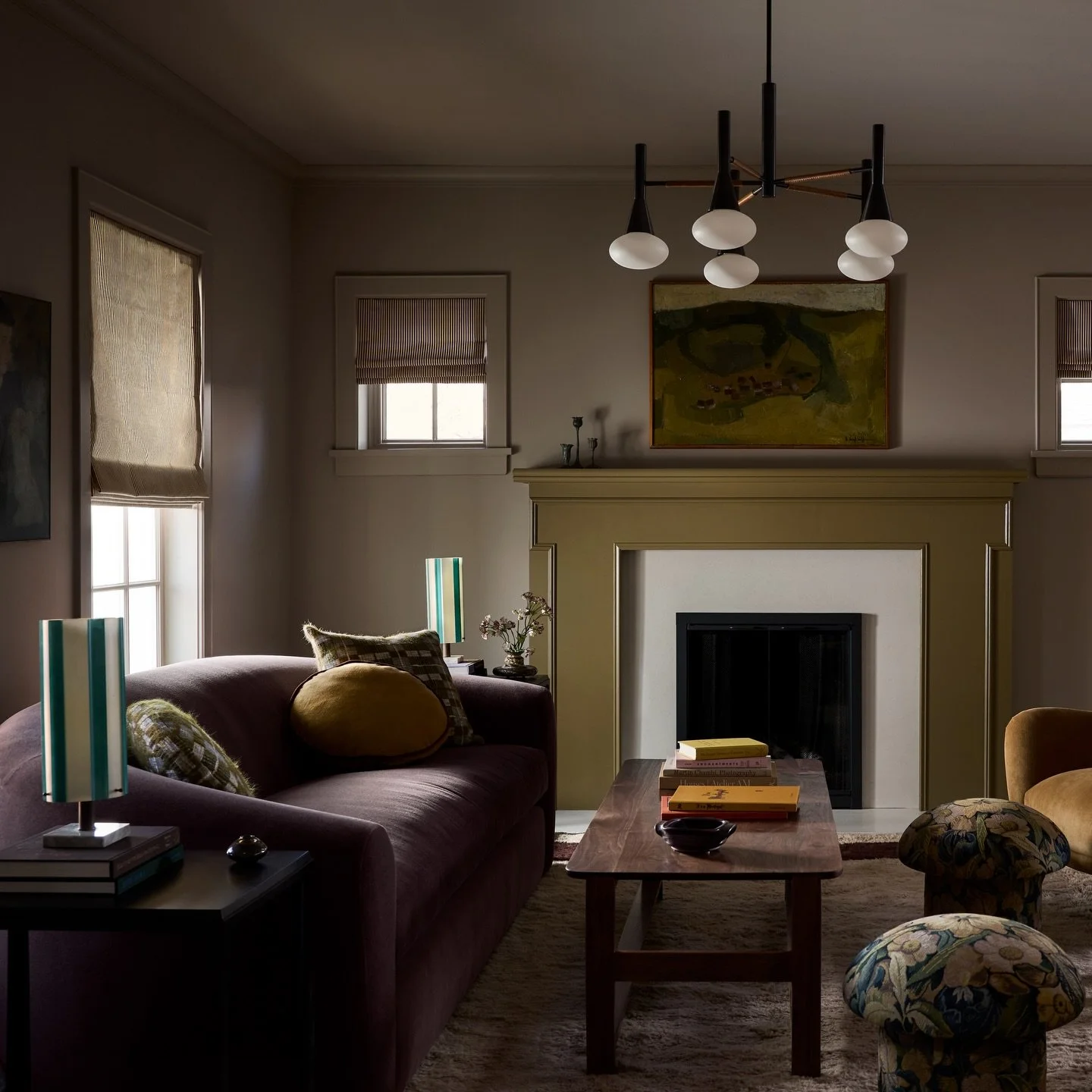 Another one of our most loved spaces of 2025 - the front living room in our recent Colorado project featured in @archdigest. We can&rsquo;t get enough of that chunky plum sofa and those ottomans 😍😍

Design: @yondinteriors 
📷: @lissmabey