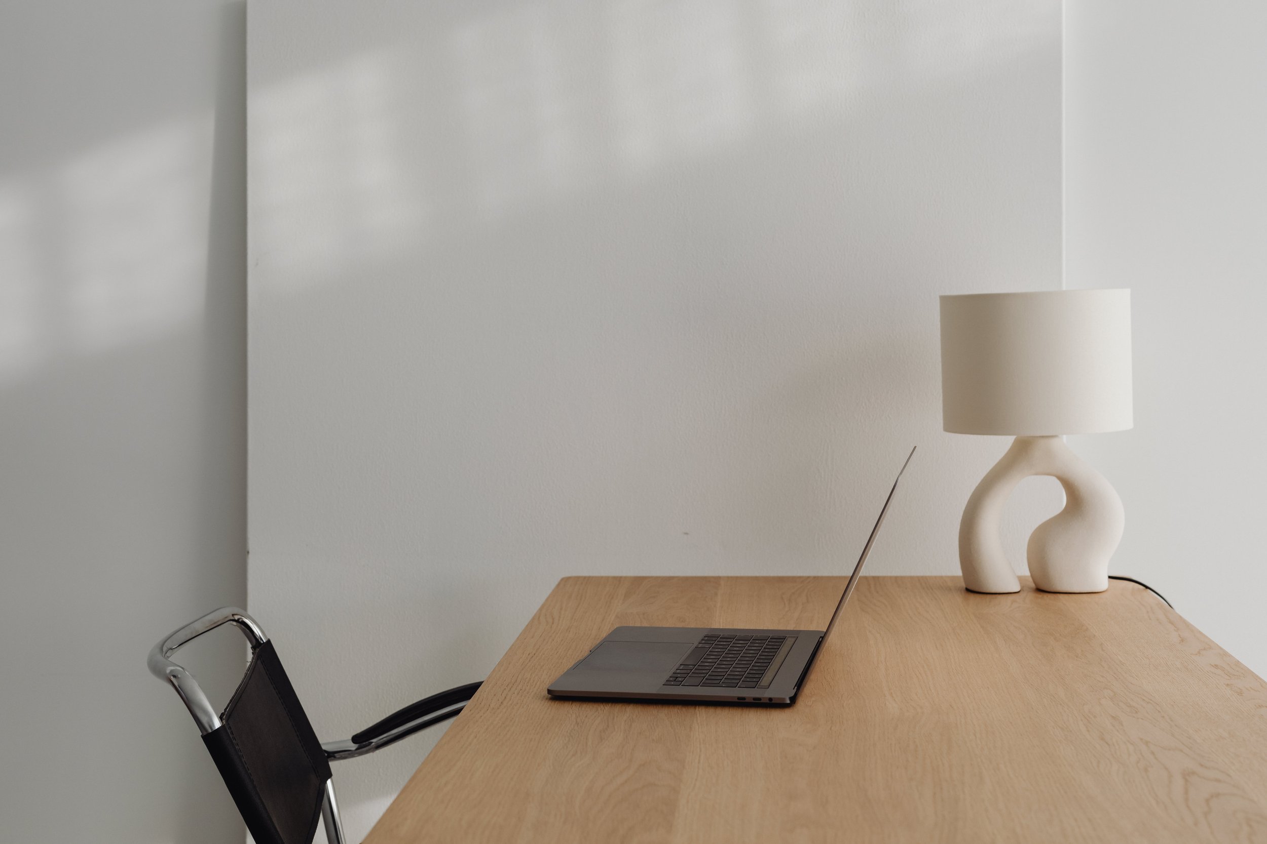 Home Office Minimal Desk with Lamp and Laptop