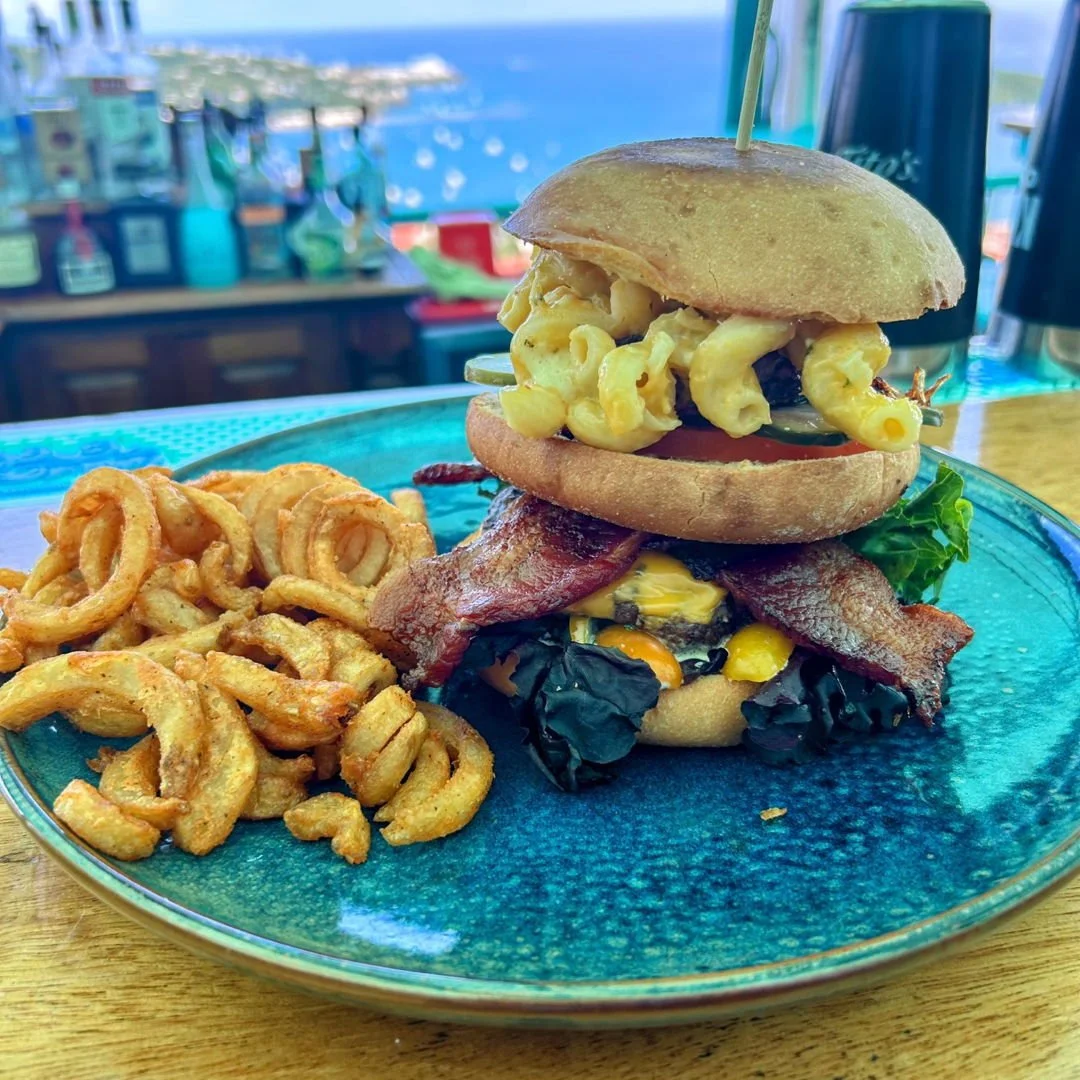 Summer is here and our happy hour is rolling out the goods! Come drop by for our newest creation: the Tower Burger. Chef's Alycia and Sean have put two quarter pound beef patties, thick cut bacon, mac and cheese, lettuce, tomato, caramelized onion an