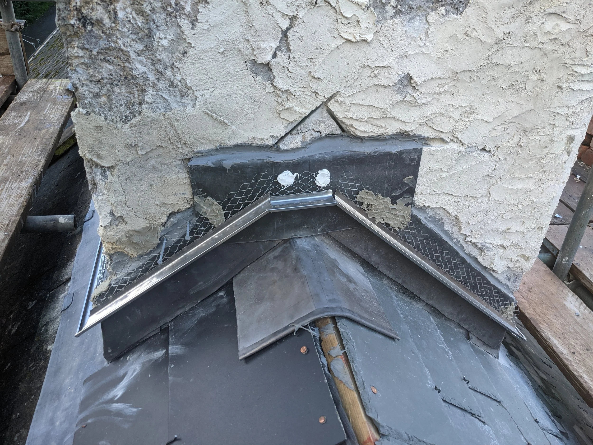 Stainless steel bell cast ready for lime render.