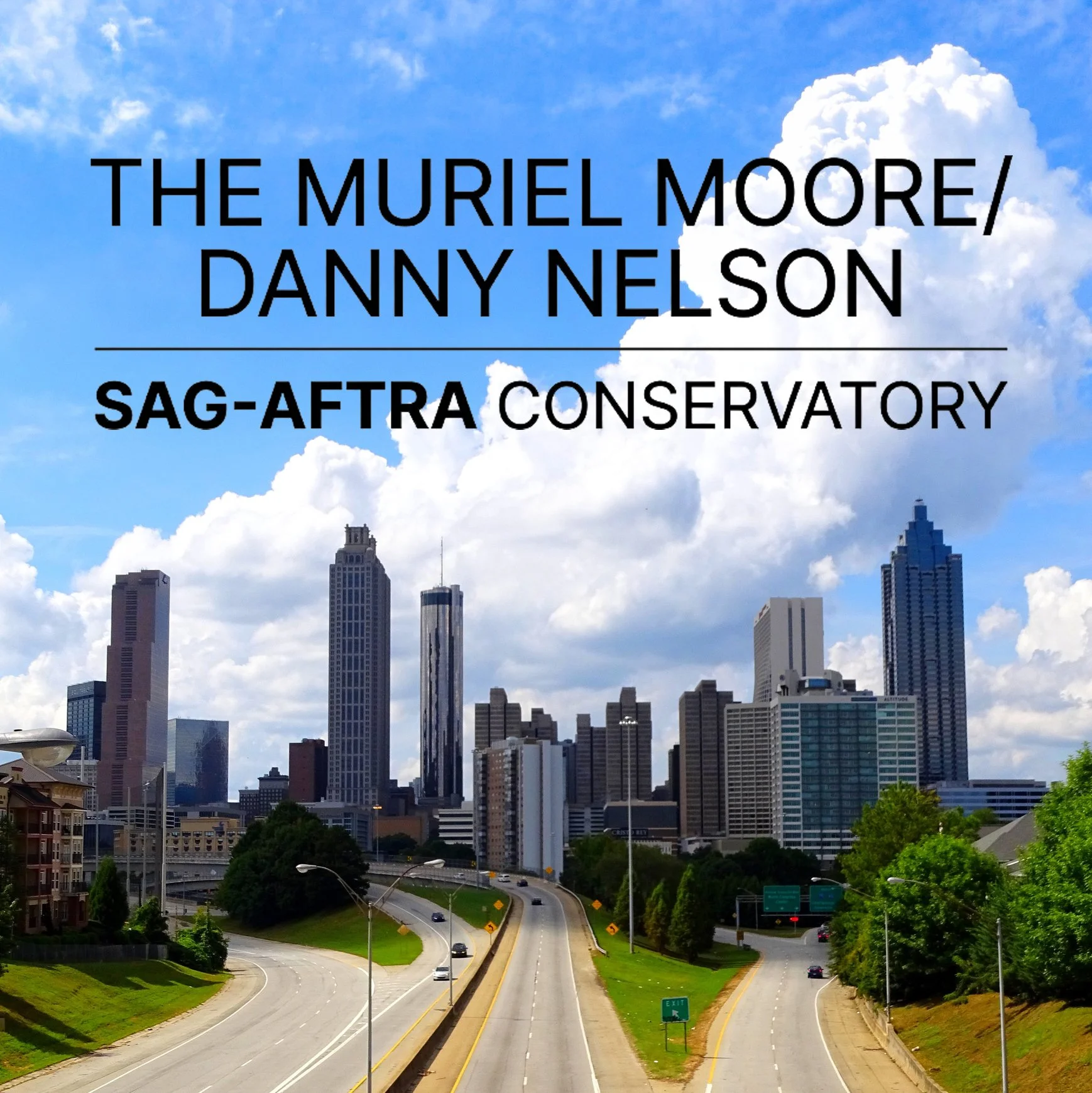 Skyline of downtown Atlanta with clouds and roads in the foreground