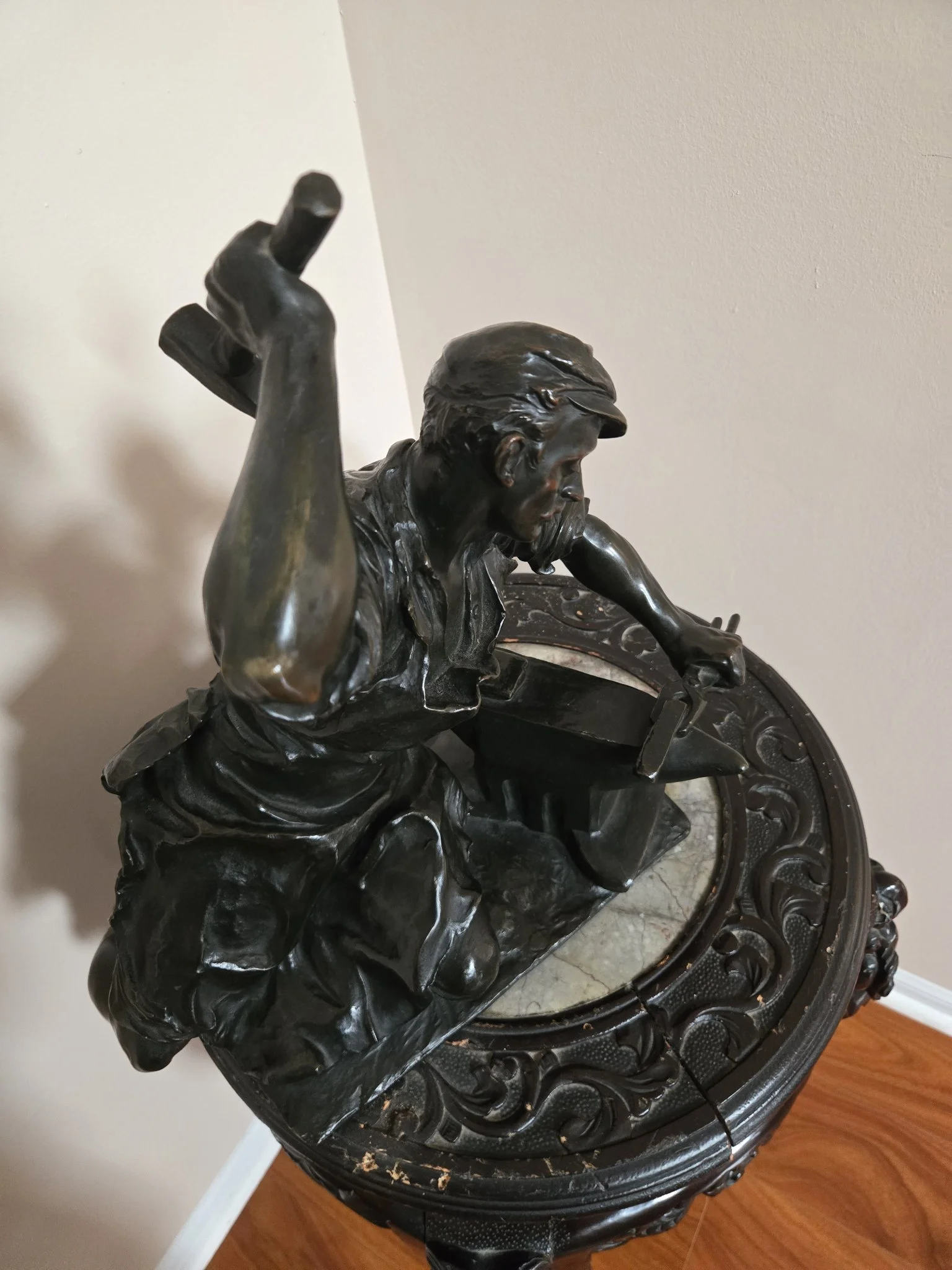 Bronze blacksmith statue at an anvil