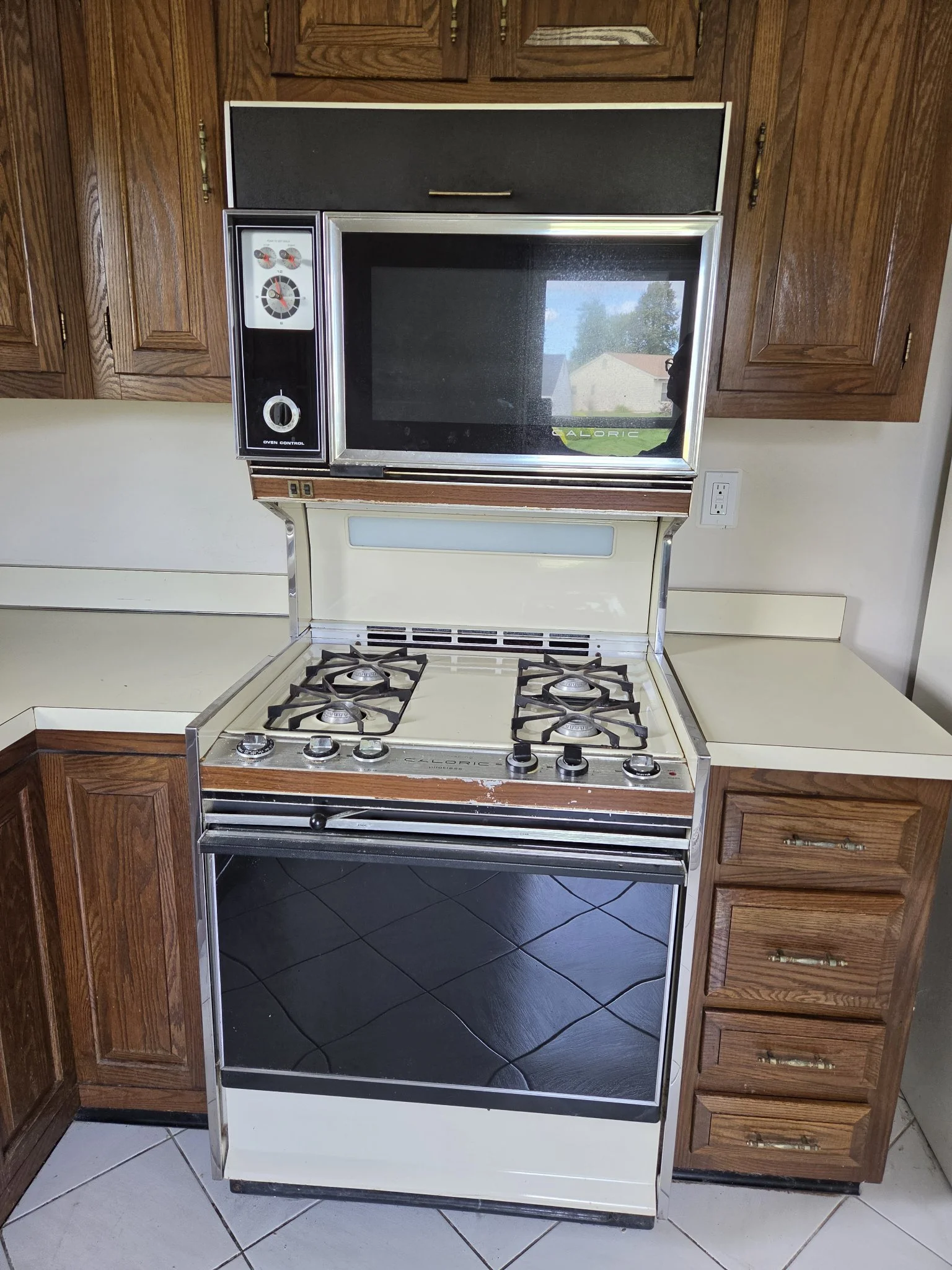 Vintage Caloric stove and oven in a wood-cabinet kitchen