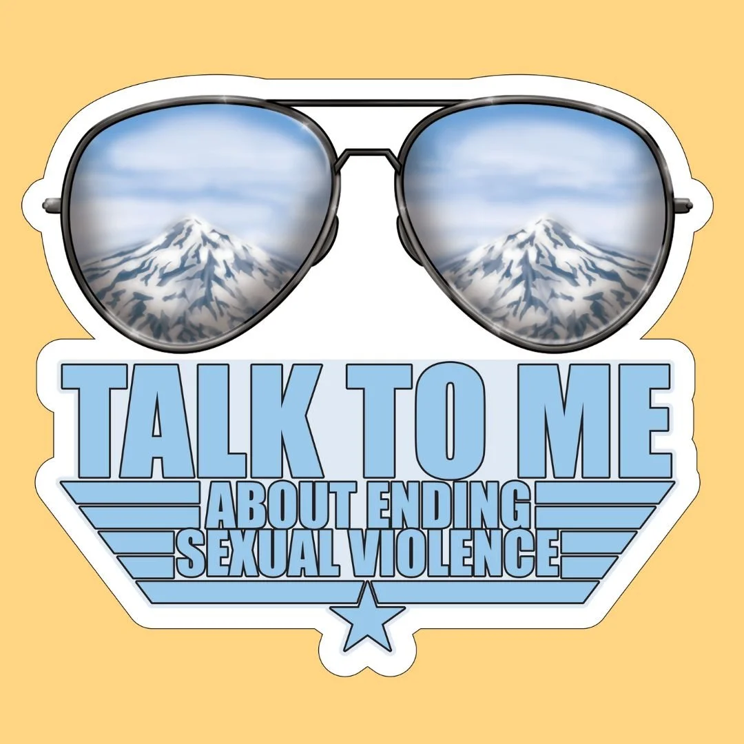 Sunglasses reflecting mountains above text 'Talk to Me About Ending Sexual Violence' on a yellow background.