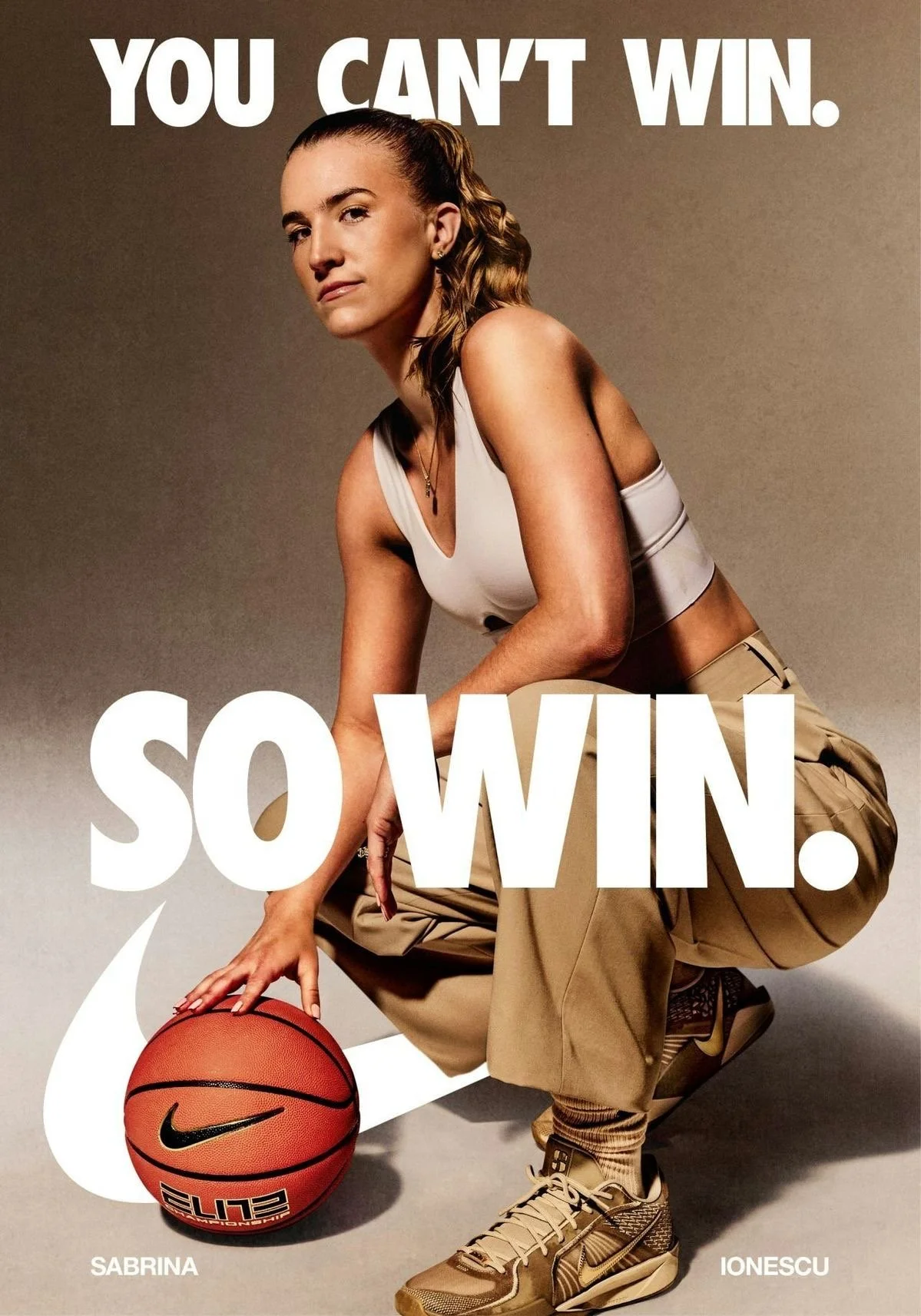 Nike ad with words at the top reading 'You Can't Win' - beneath is a female basketball player crouching down with a ball and the words 'So Win.'