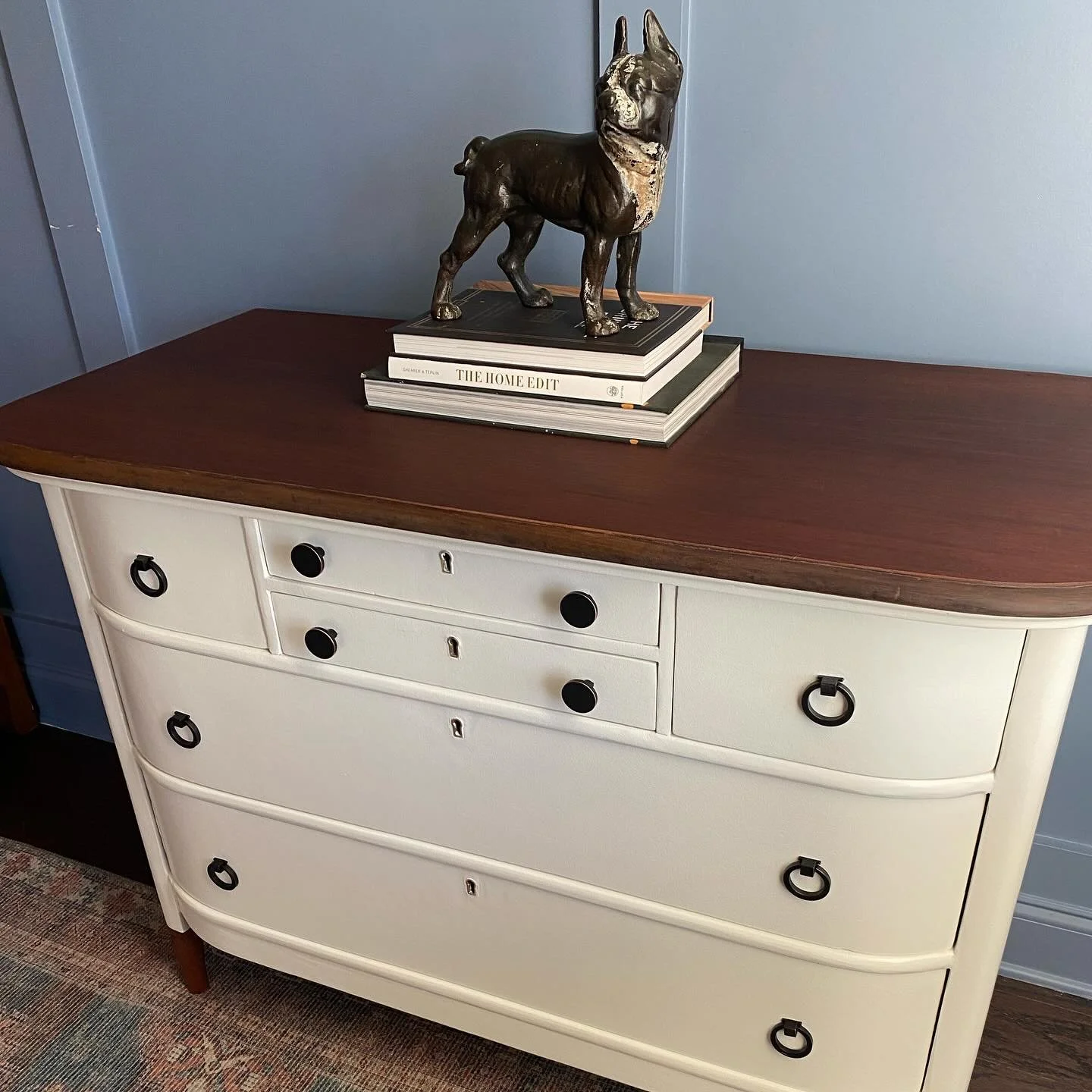 Transformation Tuesday! Another commissioned piece. 
Refinished this beautifully curved chest of drawers by stripping and staining the top and feet. I also sanded and repainted the drawers and casing and updated the knobs. Swipe to see the original v