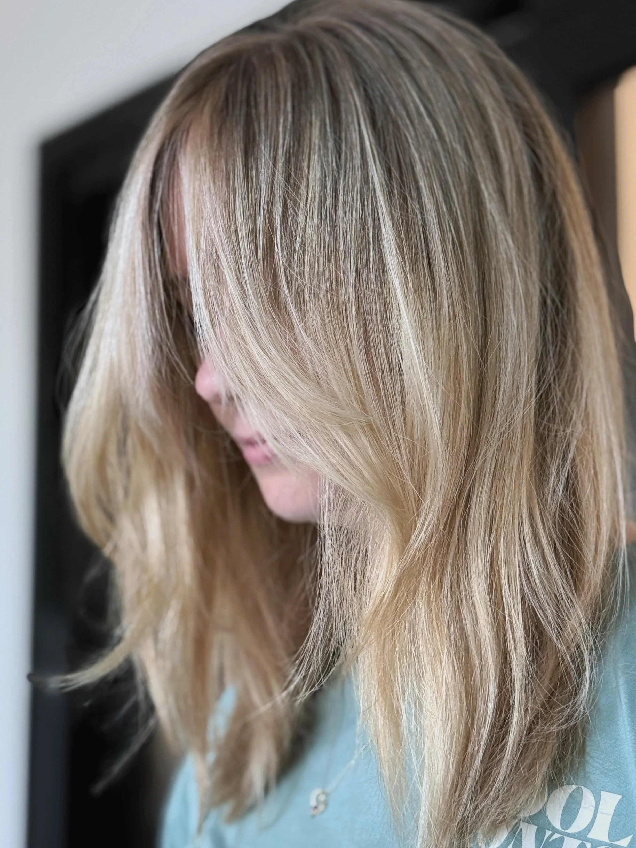 When you get the urge to chop all your hair off or color it pink, you really just need fresh hand painted highlights.
