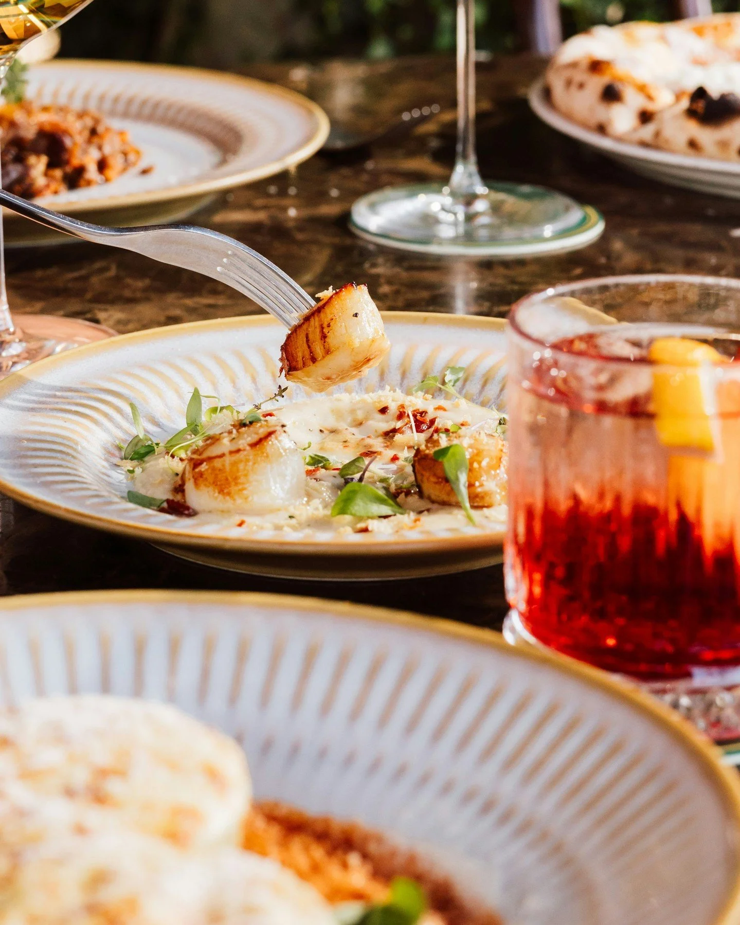 Scallops you won't want to share, pan seared and served on a bed of cauliflower puree, topped with crispy pancetta and pangrattato 🤤