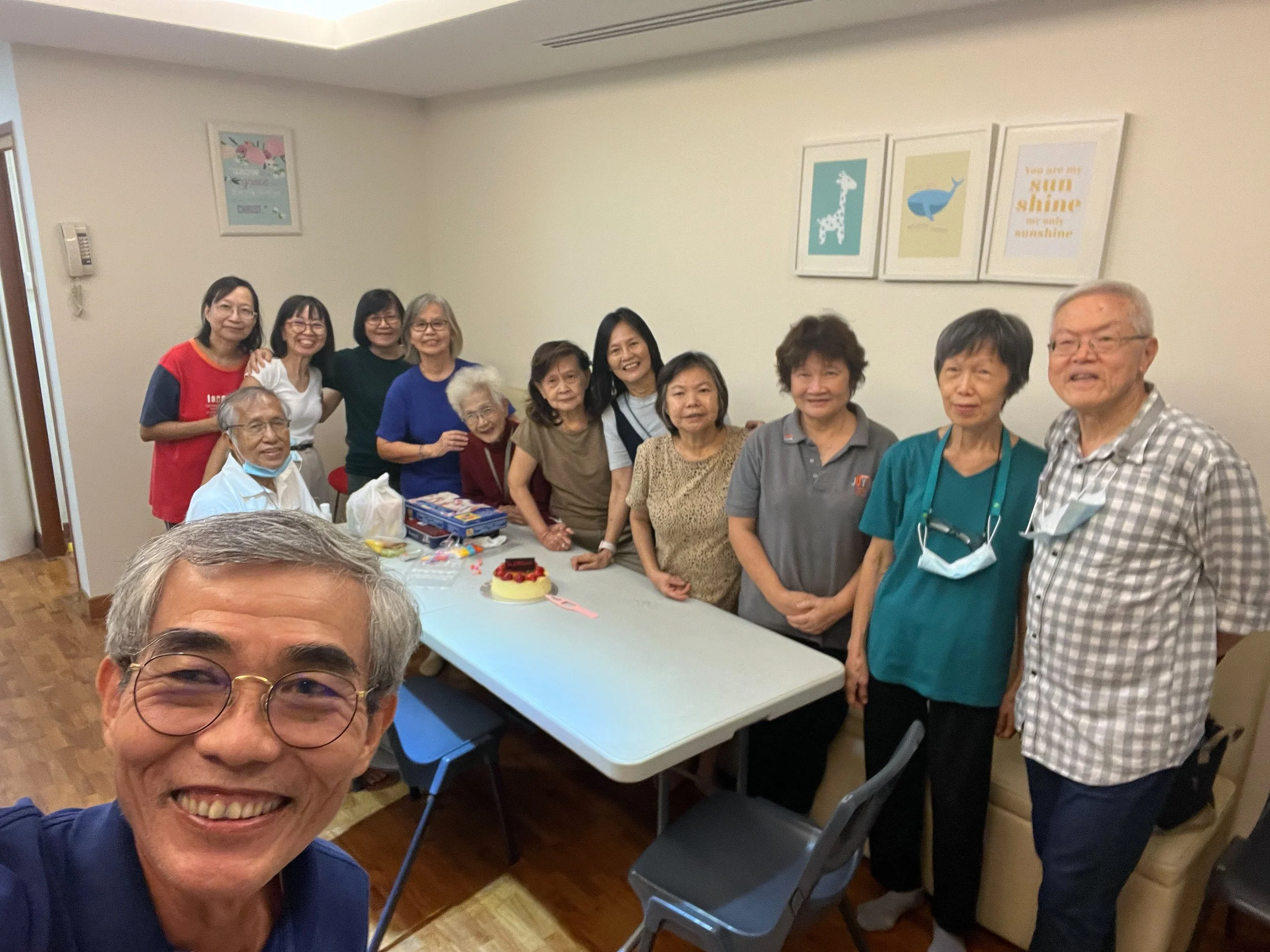 Caleb85 group gathering with cake 4032x3024.jpg
