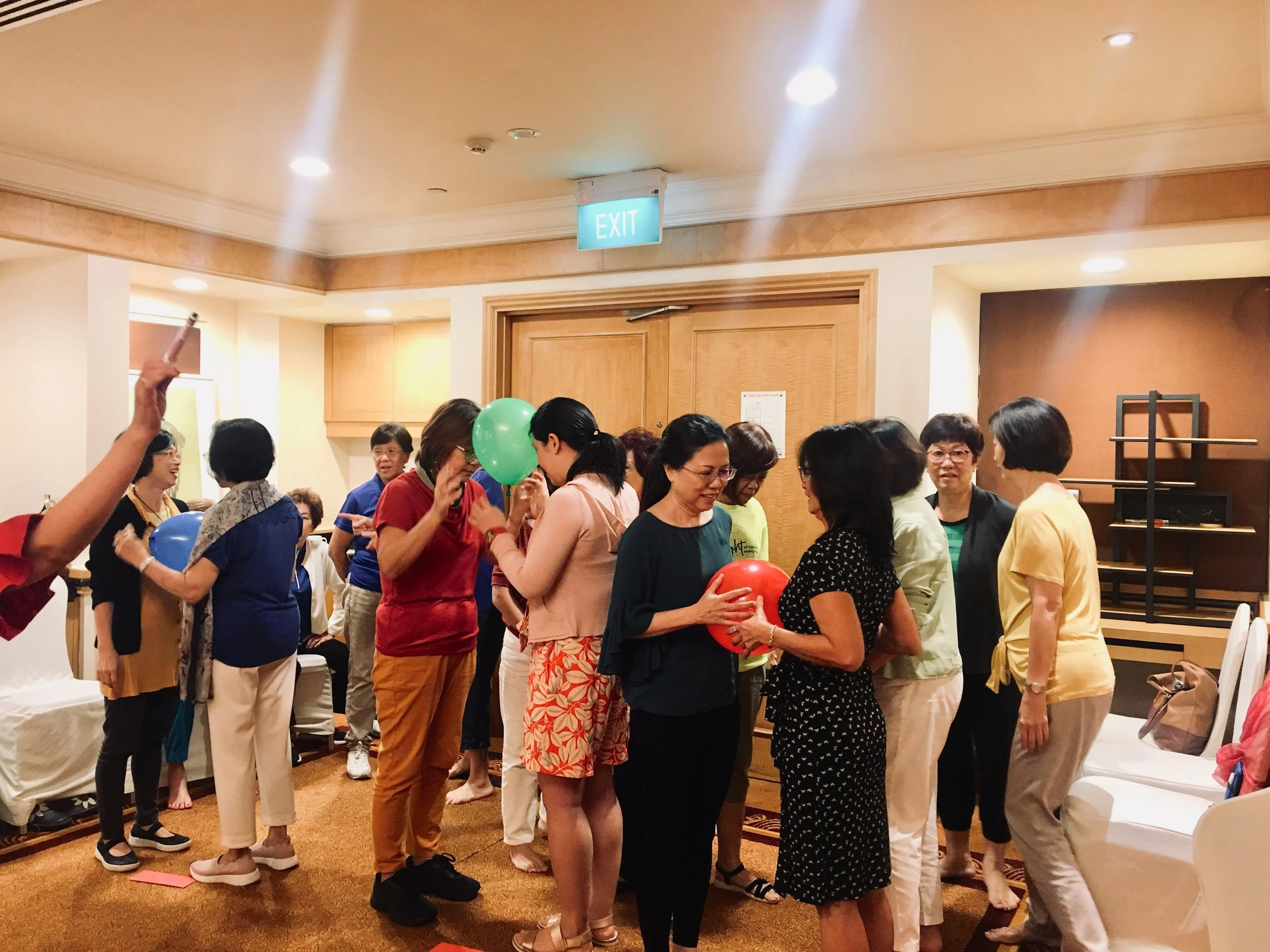 WSCS 2019 retreat group game with balloon in ballroom 4032x3024.jpg