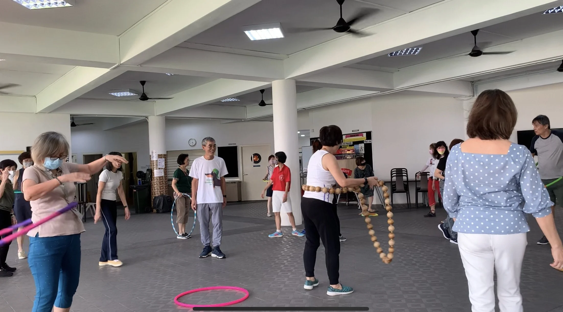 WSCS exercise with hoops at Aldersgate Chapel social hall 2203x1223.JPG