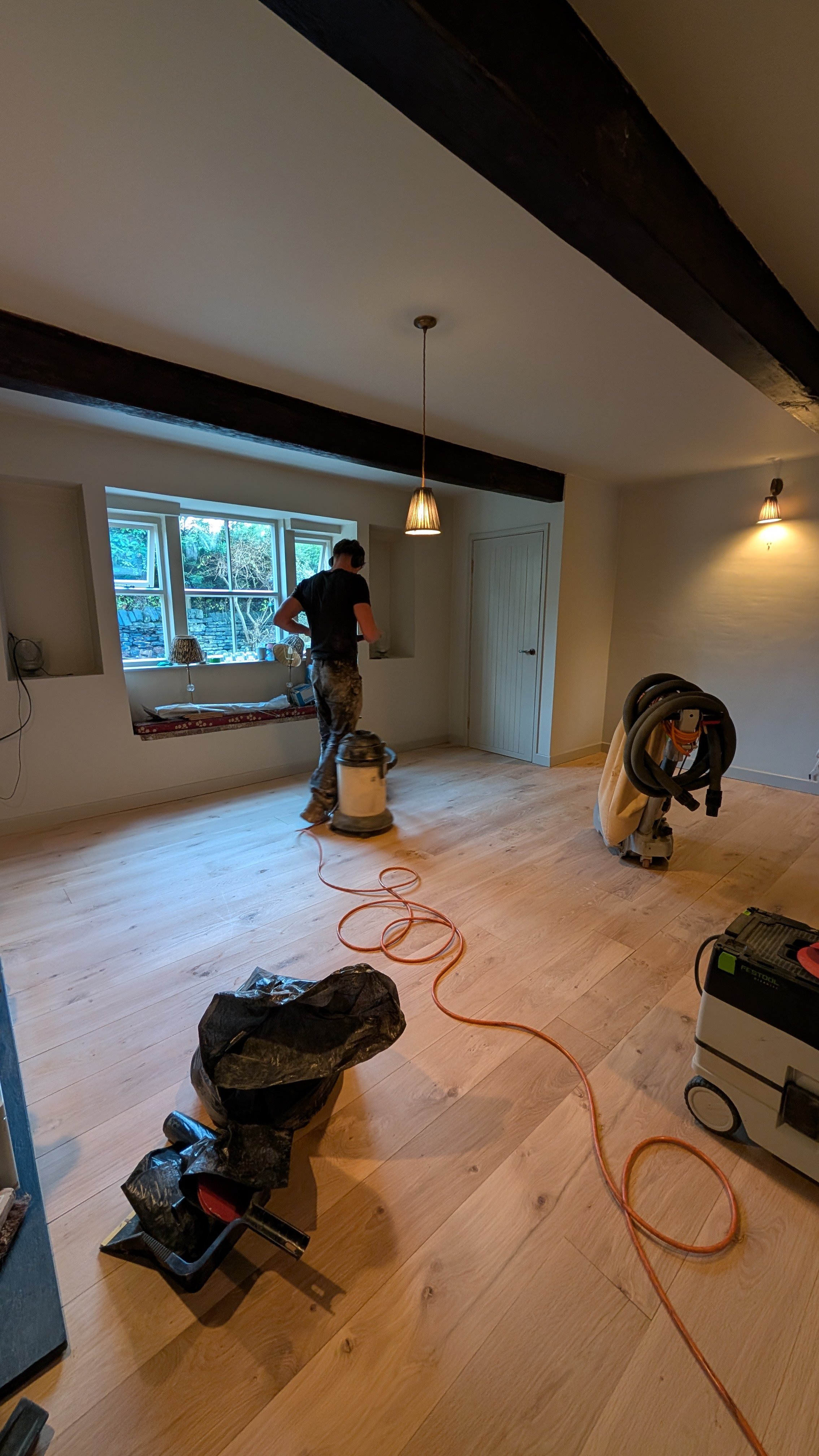 Solid oak floor being sanded