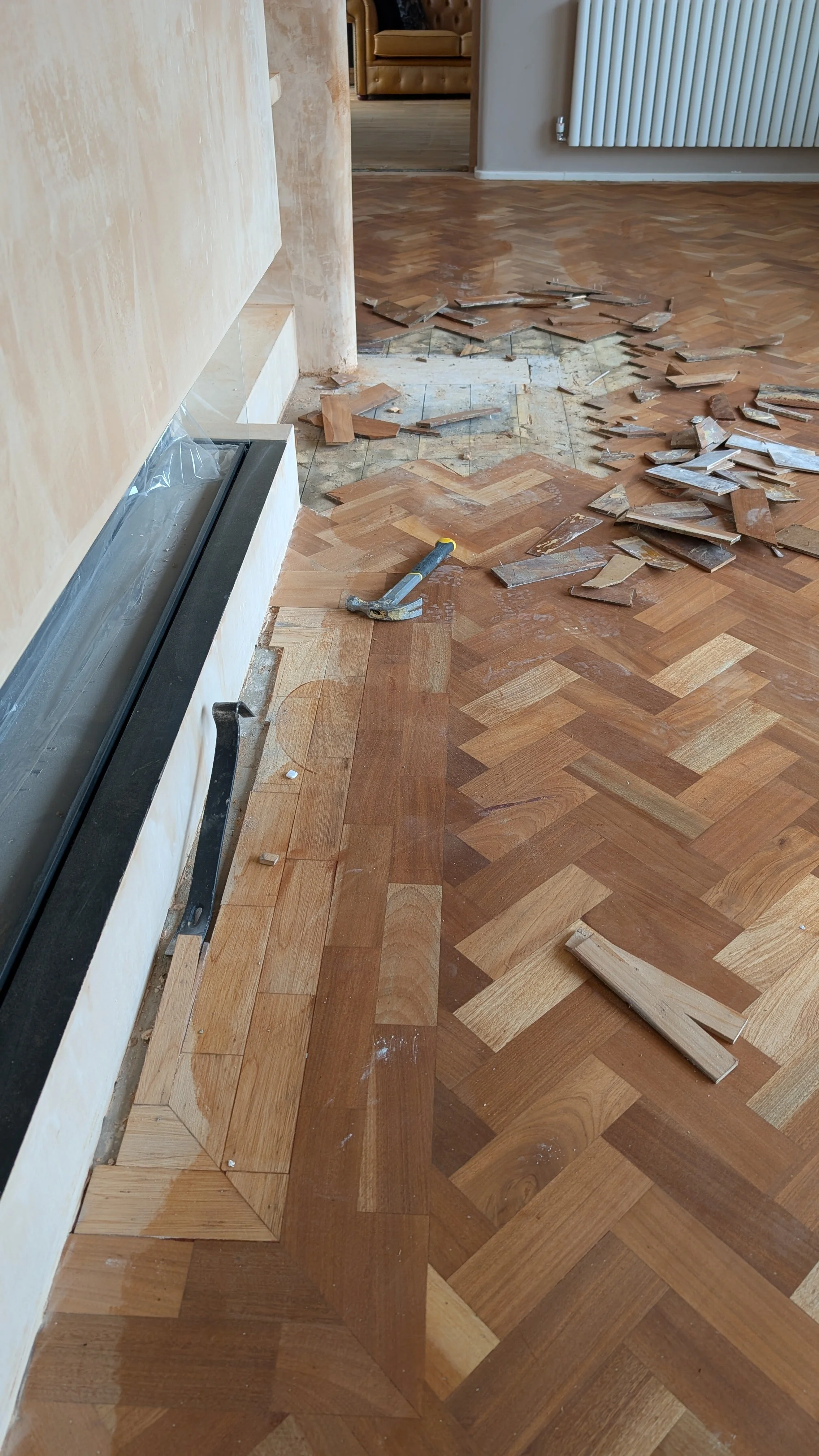 Parquet flooring being patch repaired