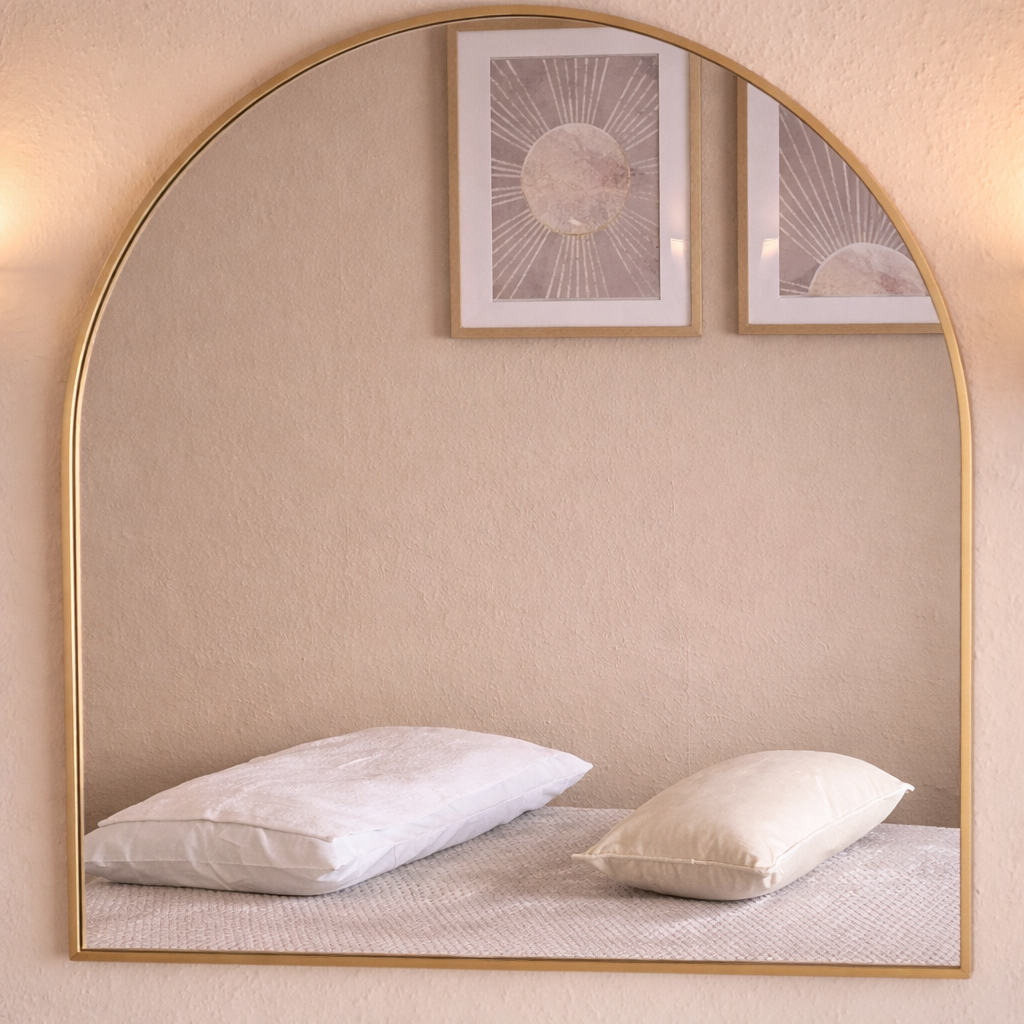 Serene bedroom reflection in a mirror.png
