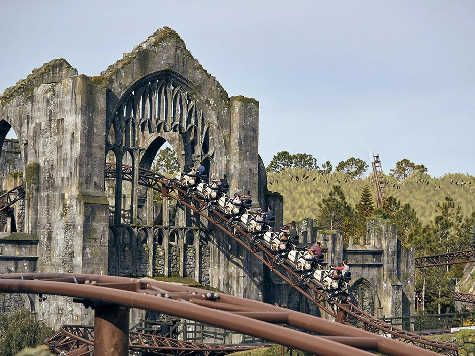 Coaster flying through the “Rose Window” of the the ruins