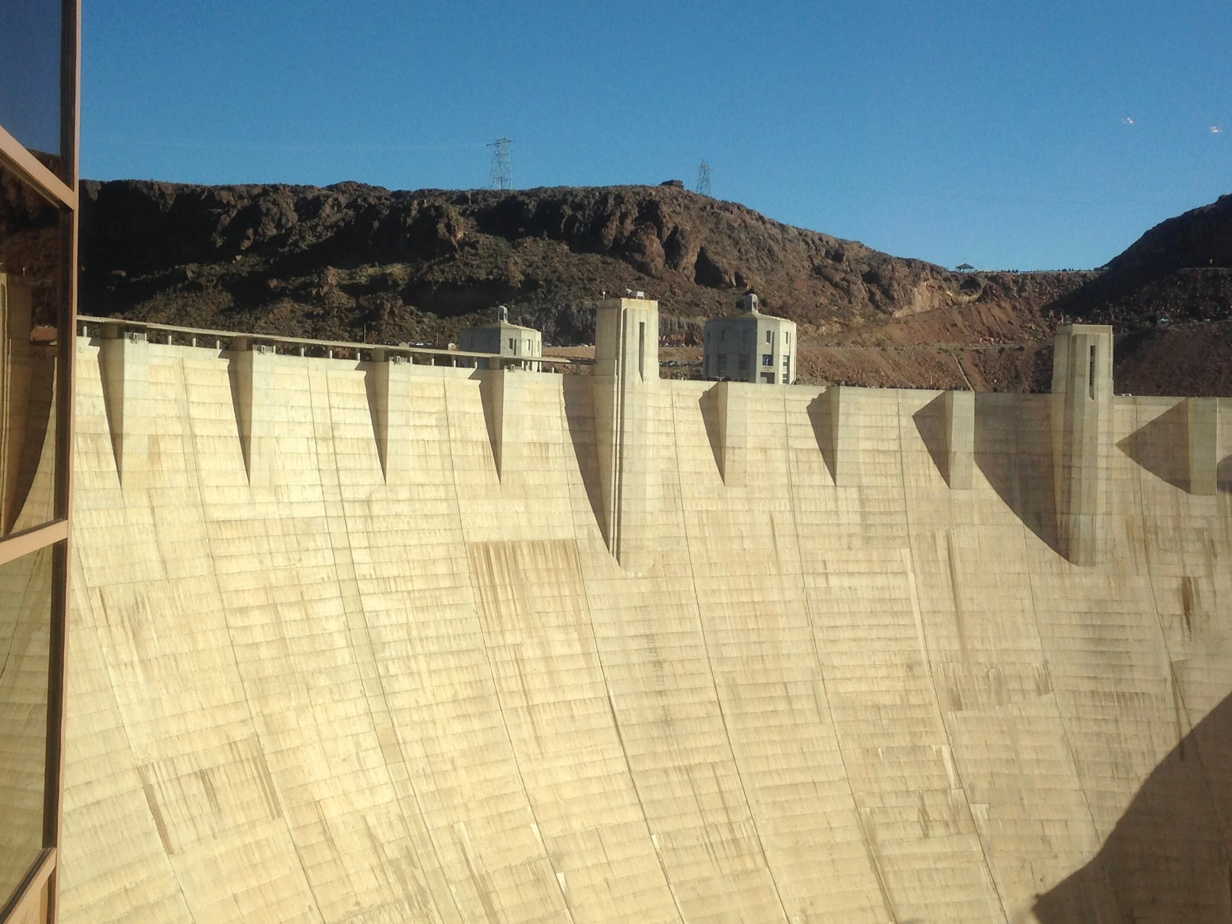 Hoover Dam with desert landscape and clear blue sky