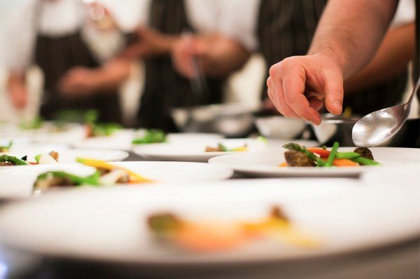  Chefs plating in the kitchen  