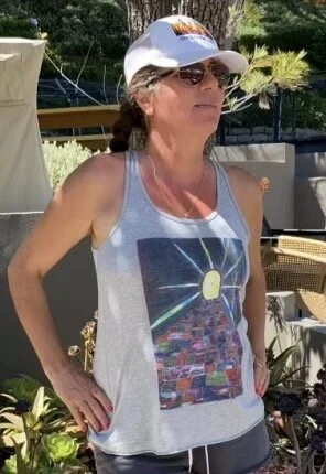 Annie's “Stepping on Colors” on healer hairdresser Linda Ciana.  Click photo to buy Tank Tops by Annie.