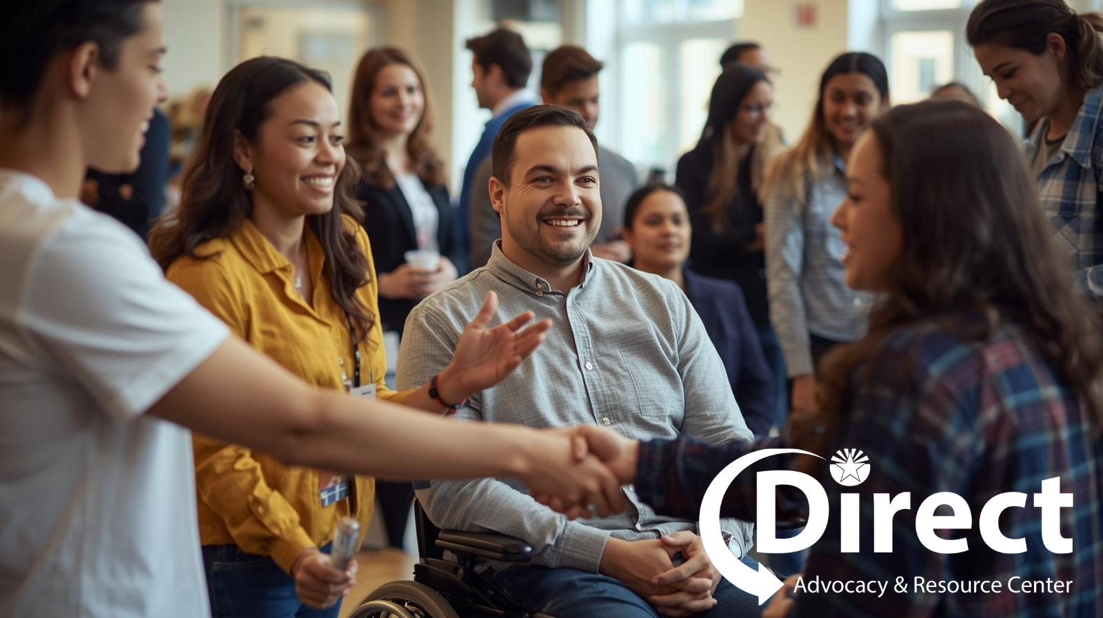 A diverse group of people smile and connect with one another at a hiring event