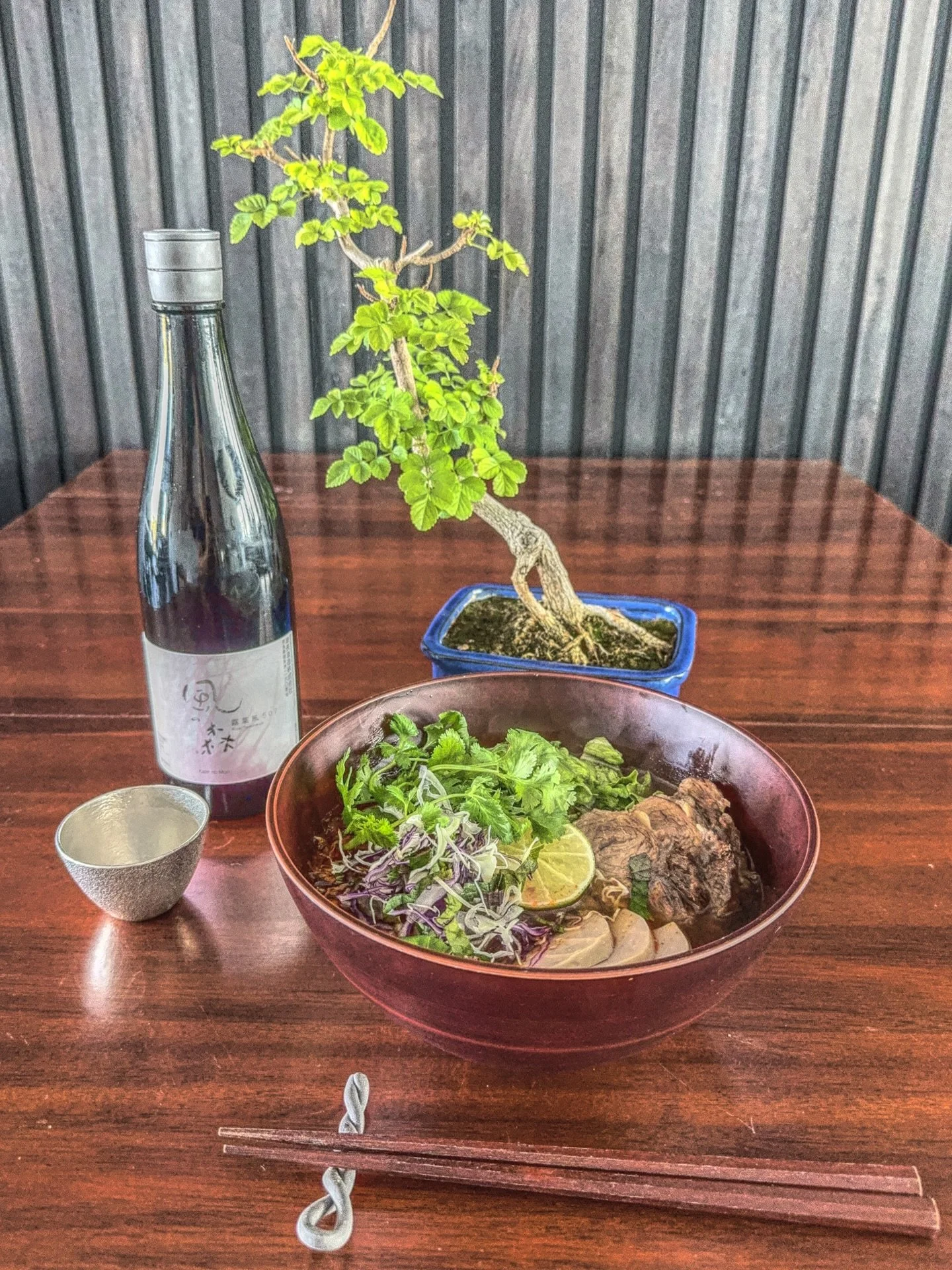 &bull;|&bull; B&uacute;n b&ograve; Huế, the fiery Vietnamese beef noodle soup layered with lemongrass, chili, and fermented shrimp paste, finds a surprising complement in Kaze no Mori Pink Label 507, an unpasteurised, unfiltered, undiluted sake from 