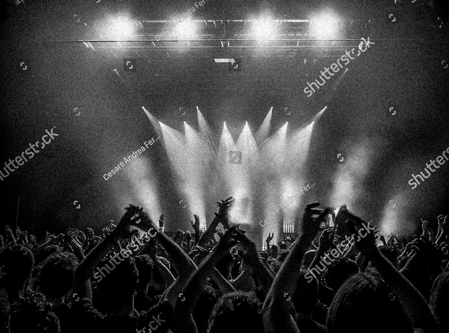 stock-photo-concert-crowd-attending-a-concert-people-silhouettes-are-visible-backlit-by-stage-lights-raised-1036108582-3.jpg