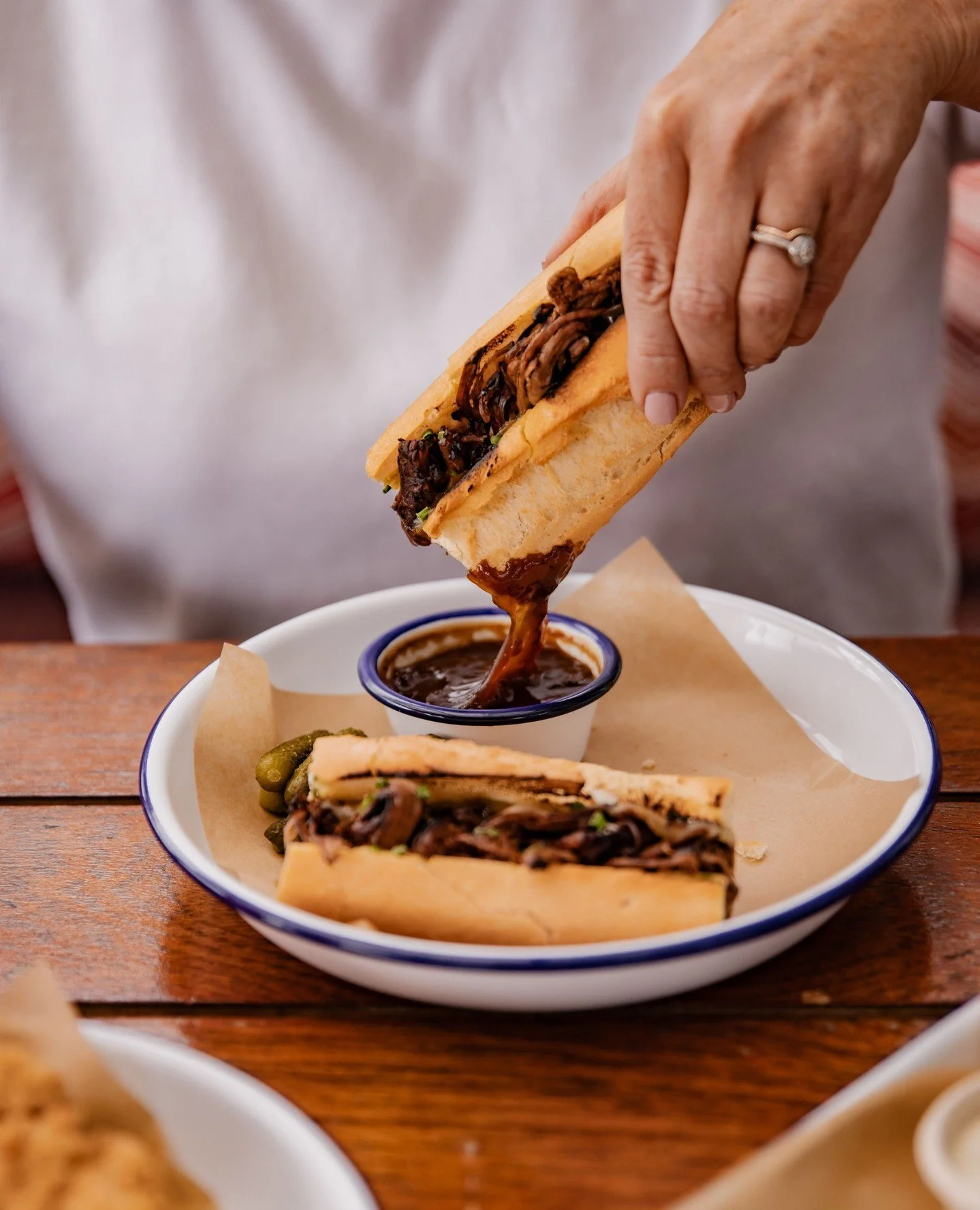 When a sandwich becomes the sandwich. 🥖🔥⁠
⁠
Our French Dip is officially a crowd favourite at The Deck - 12-hour slow cooked beef brisket, sharp mustard, melted cheddar, bone marrow butter, all tucked into a perfectly toasted baguette&hellip; serve