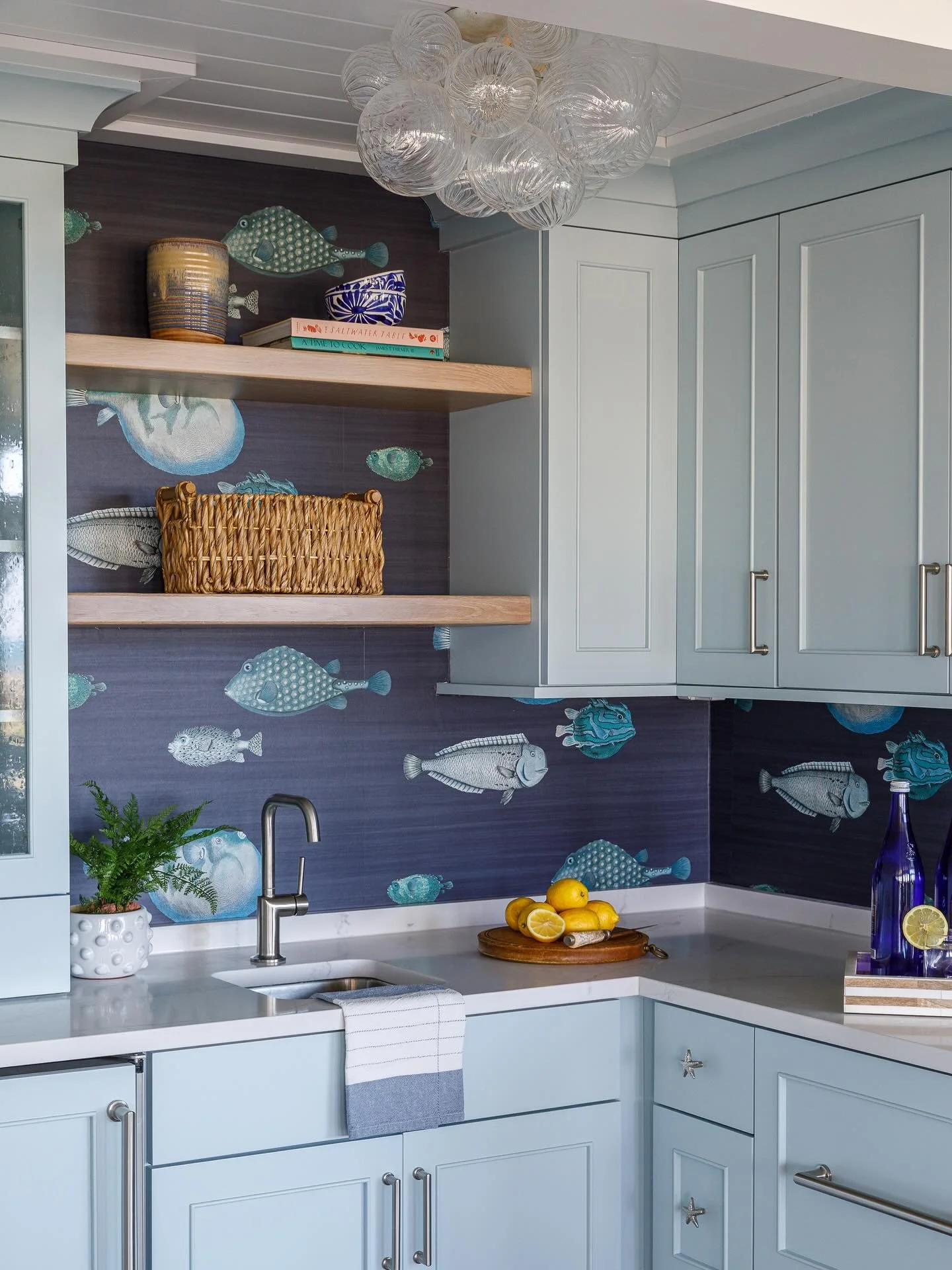 Hooked on this backsplash. 🐟

A playful coastal moment paired with soft blues, warm wood, and a little sparkle overhead.

Photo: @lynn_tennille_photography 

#InteriorDesignerLife
#InteriorDesignInspo
#DesignerDetails
#InteriorStyling
#DesignInspira