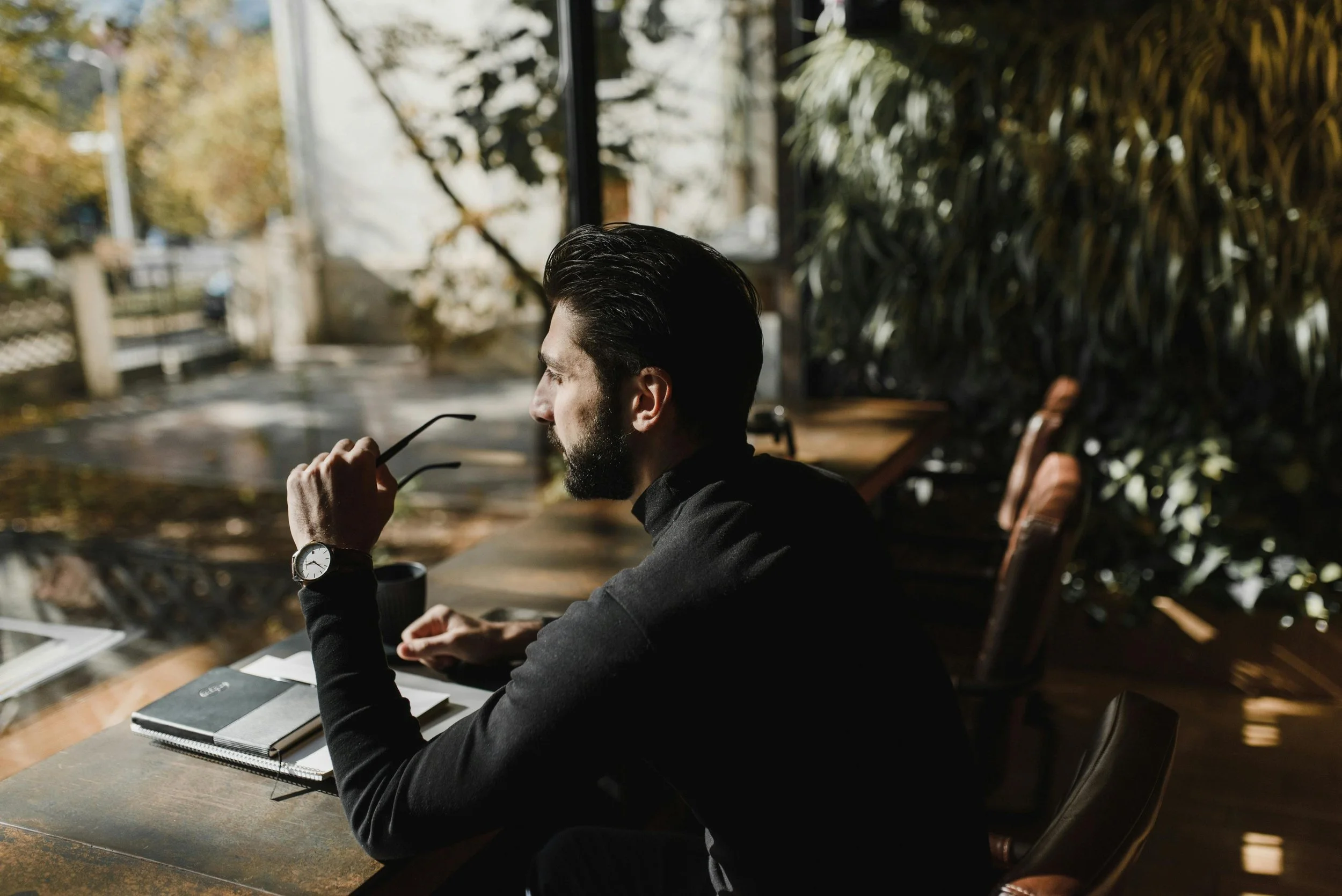 Business professional sitting quietly and preparing mentally before a meeting.