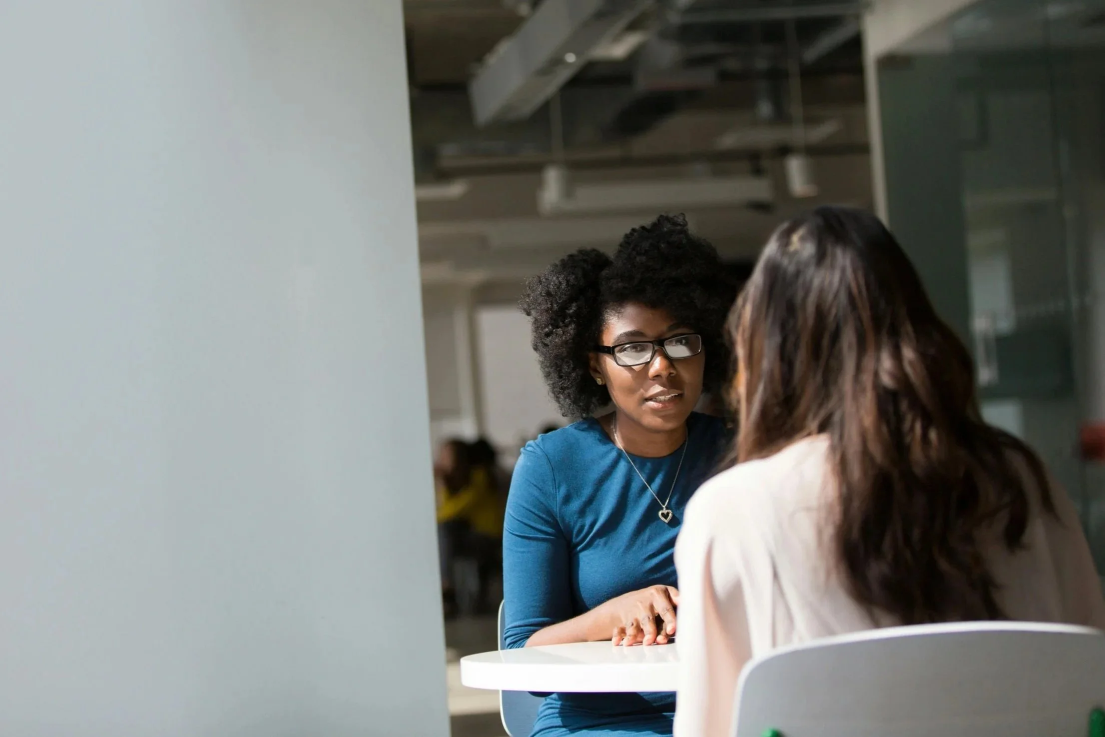 Consultant listening attentively during a conversation with a client.