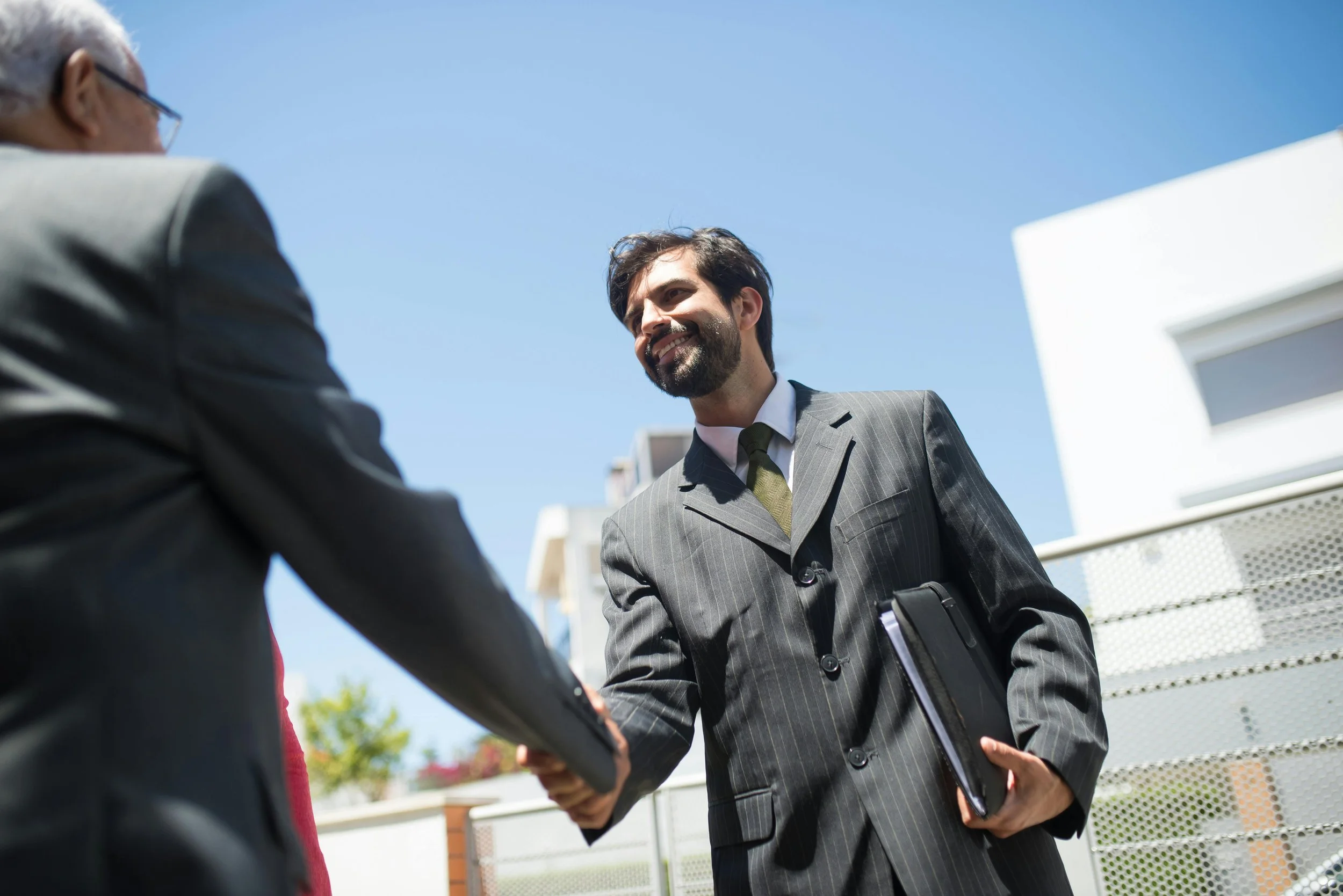 Professional confidently leading a calm and focused business conversation.