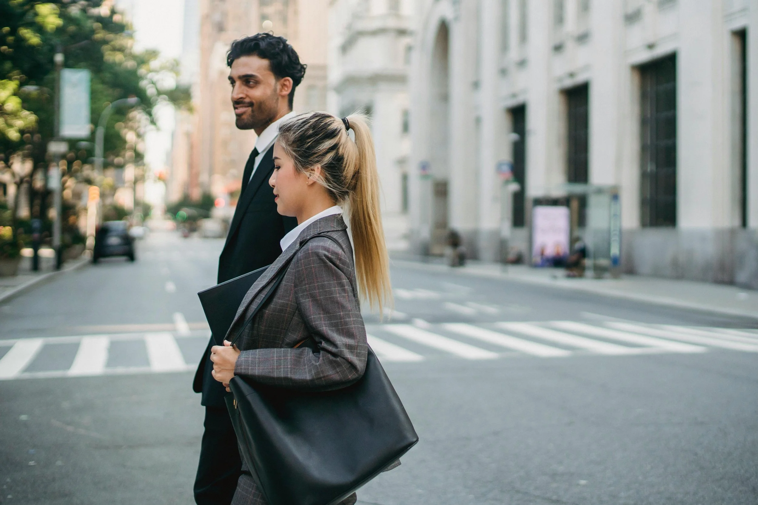 Business professional walking confidently into a meeting.
