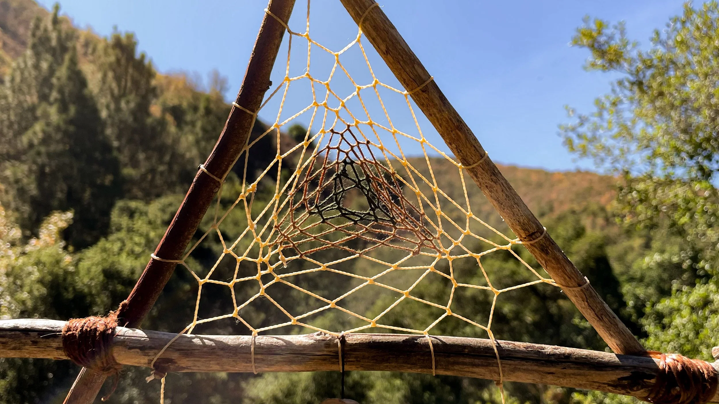 found sticks from a stream in Yucaipa, Brazilian wax thread, wooden beads, tigers eye, found feathers