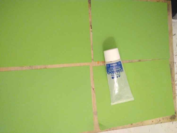Four pieces of green A4 paper and some glue to form a collar base