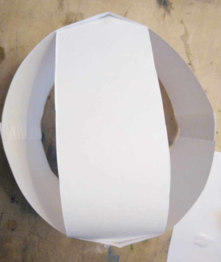 Glue paper together to form a headdress base