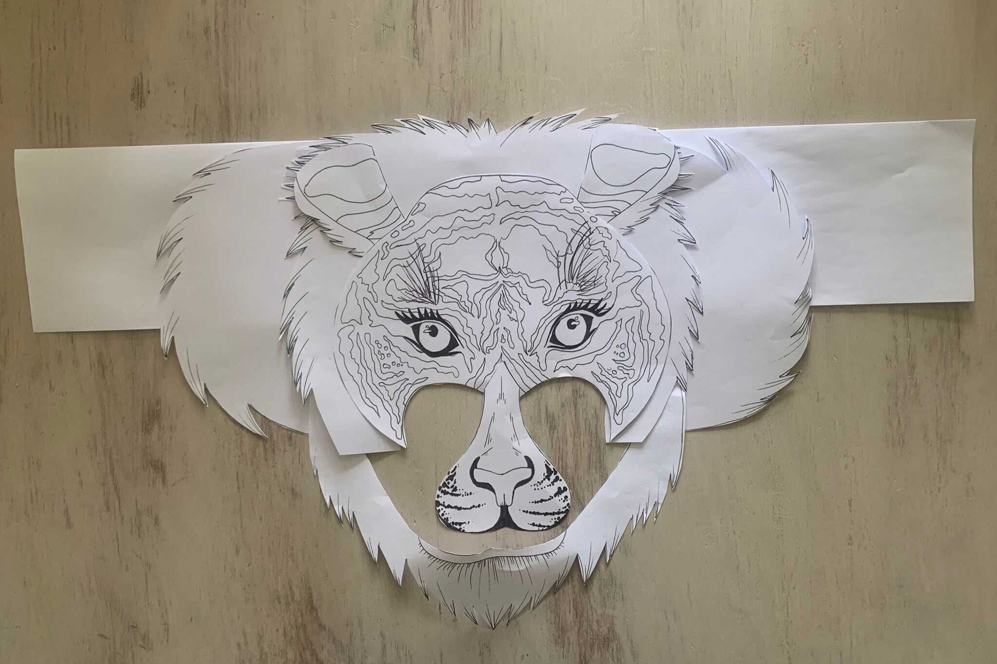 Tiger mask pieces all stuck together to form the mask