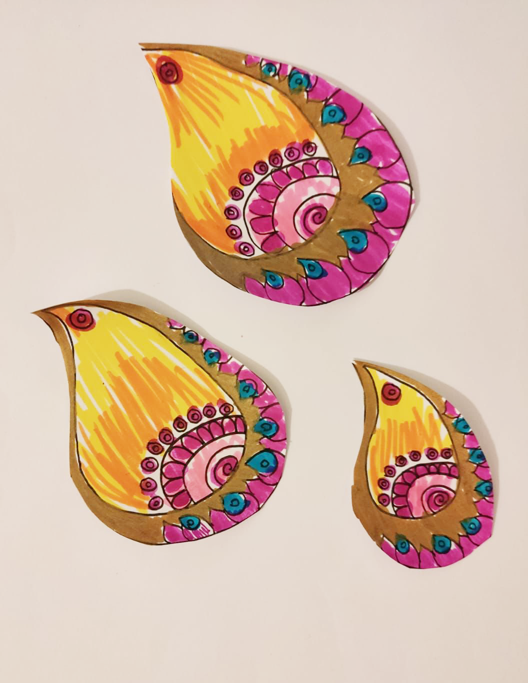 Paper diya flame shaped pieces decorated in bright colours