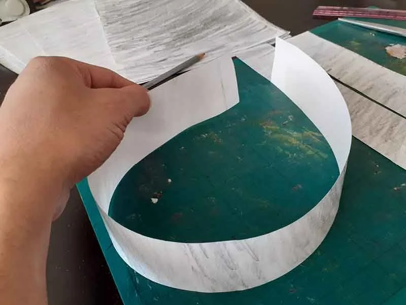 Curl the strip round to form a crown shape