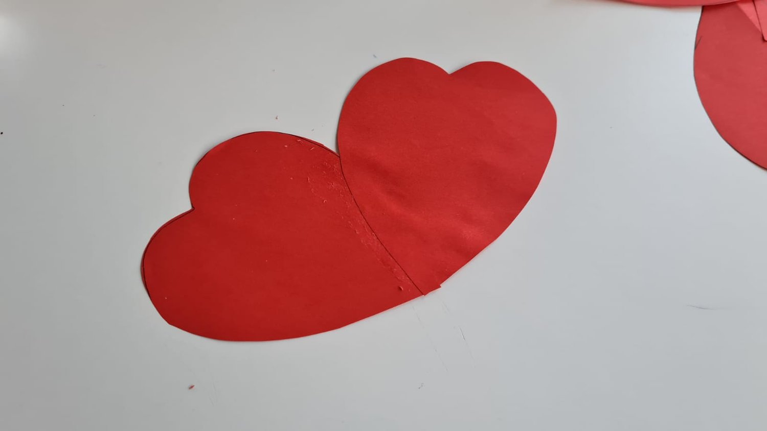 Two cut out heart shapes glued together